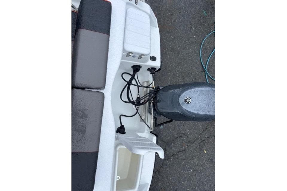 2026 Terhi 480 Cabin boat with Yamaha outboard motor, rear view.