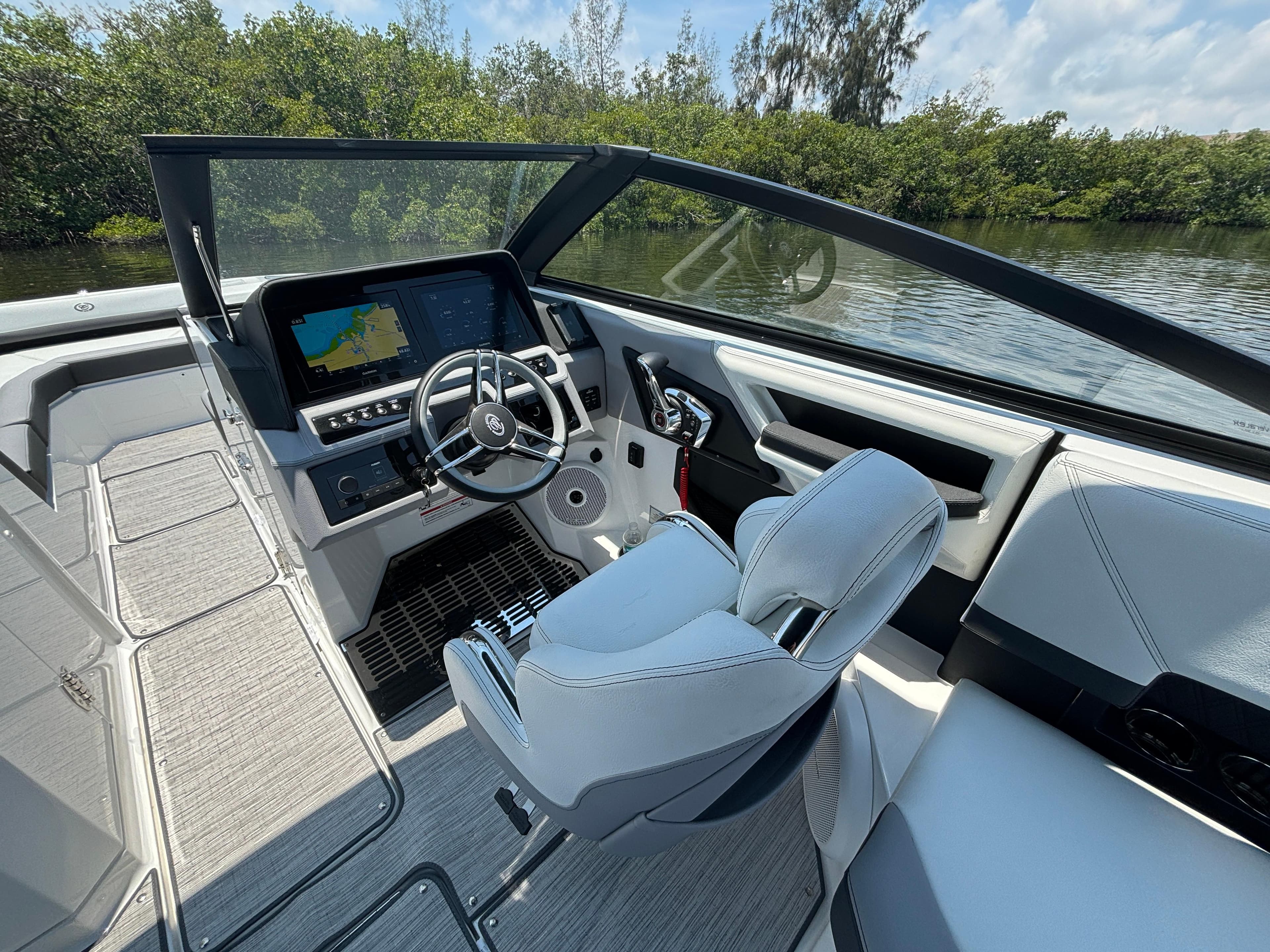 2024 Cobalt R8 Outboard boat interior with modern dashboard and steering wheel.