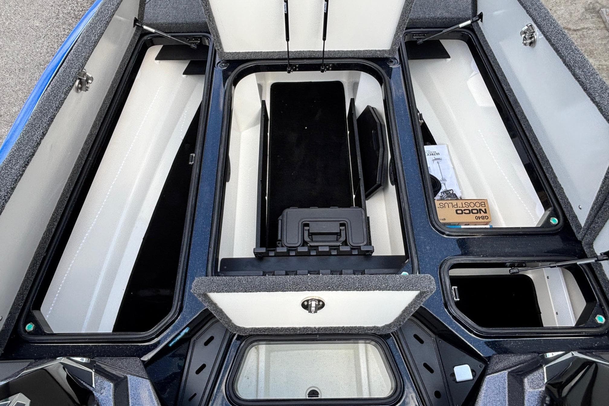 2026 Ranger Z520R boat storage compartments open, showcasing organized interior layout.