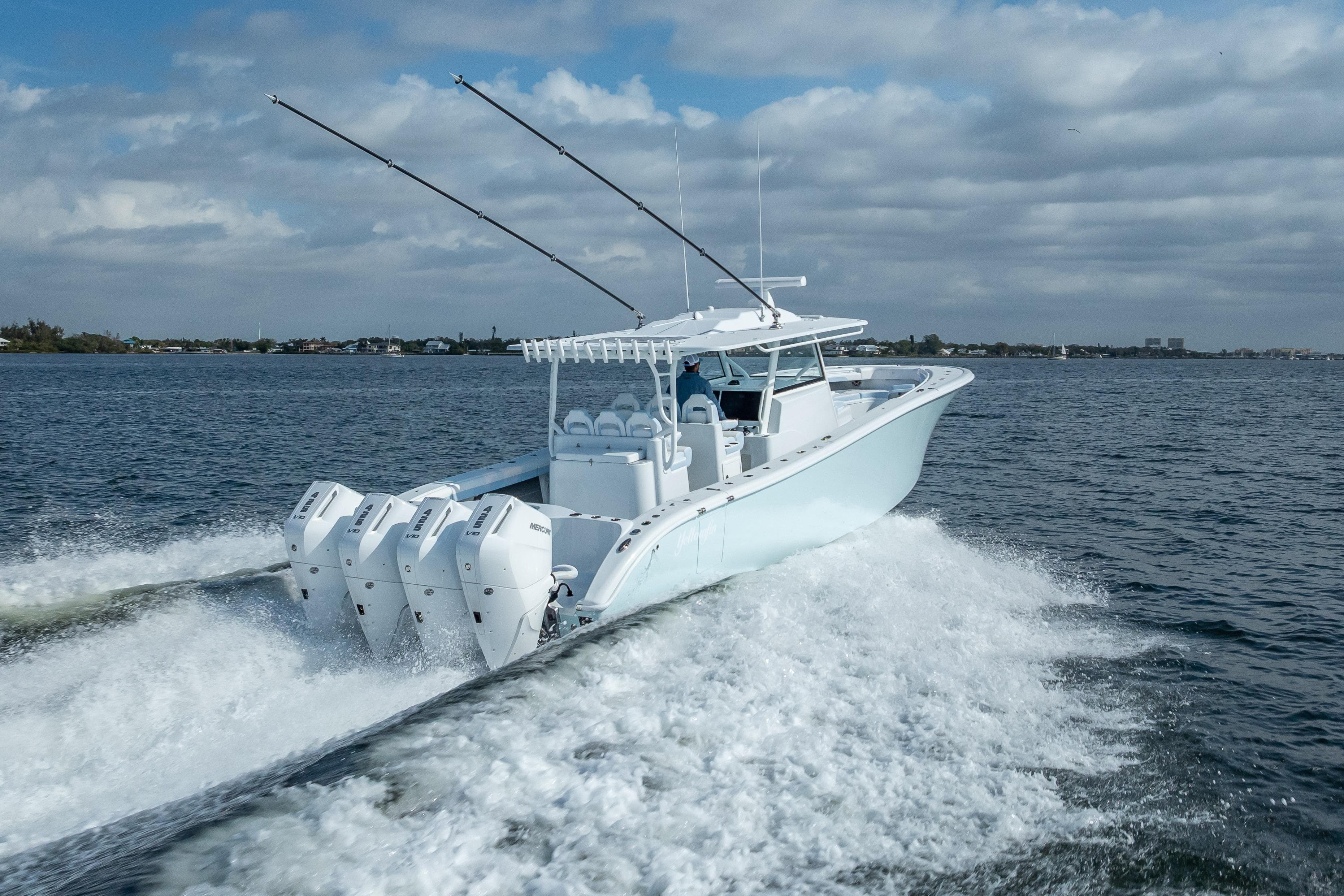 2026 Yellowfin 42 Offshore boat cruising on open water with four engines.