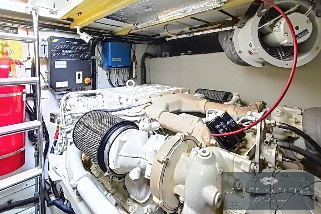 Engine room of a 2004 Princess V58 yacht, featuring mechanical components and equipment.