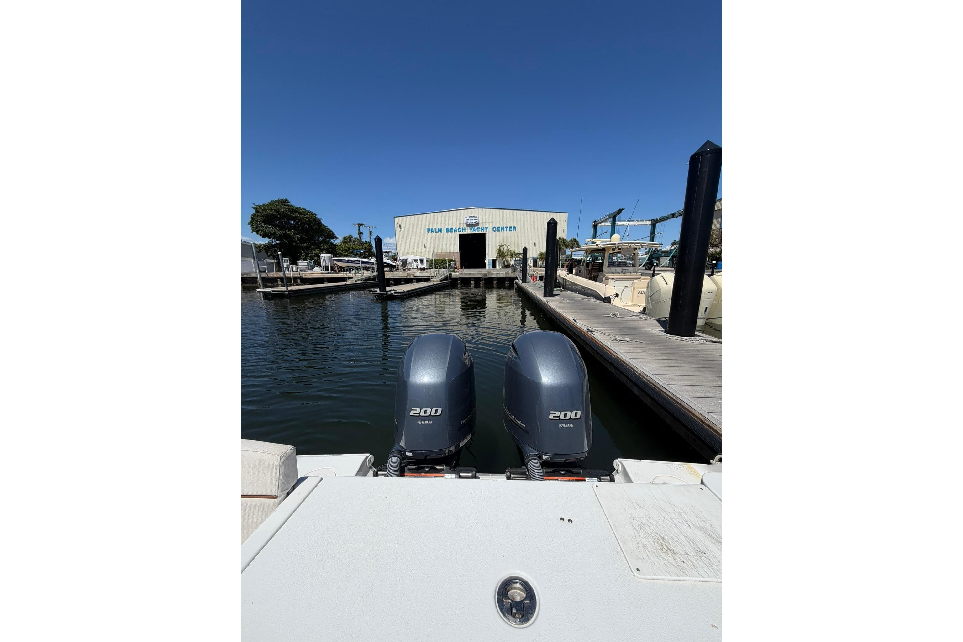2021 Sea Hunt Gamefish 27 Coffin Box at marina with dual 200 engines.