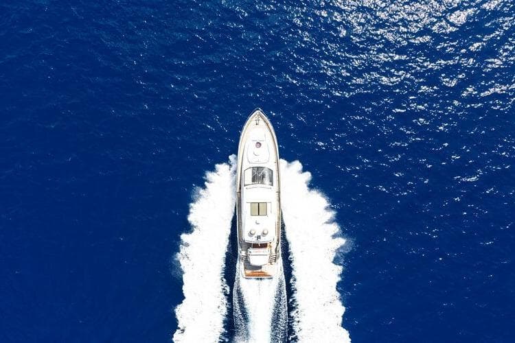 Aerial view of 2017 Sessa Marine C68 Cruiser navigating through deep blue ocean waters.