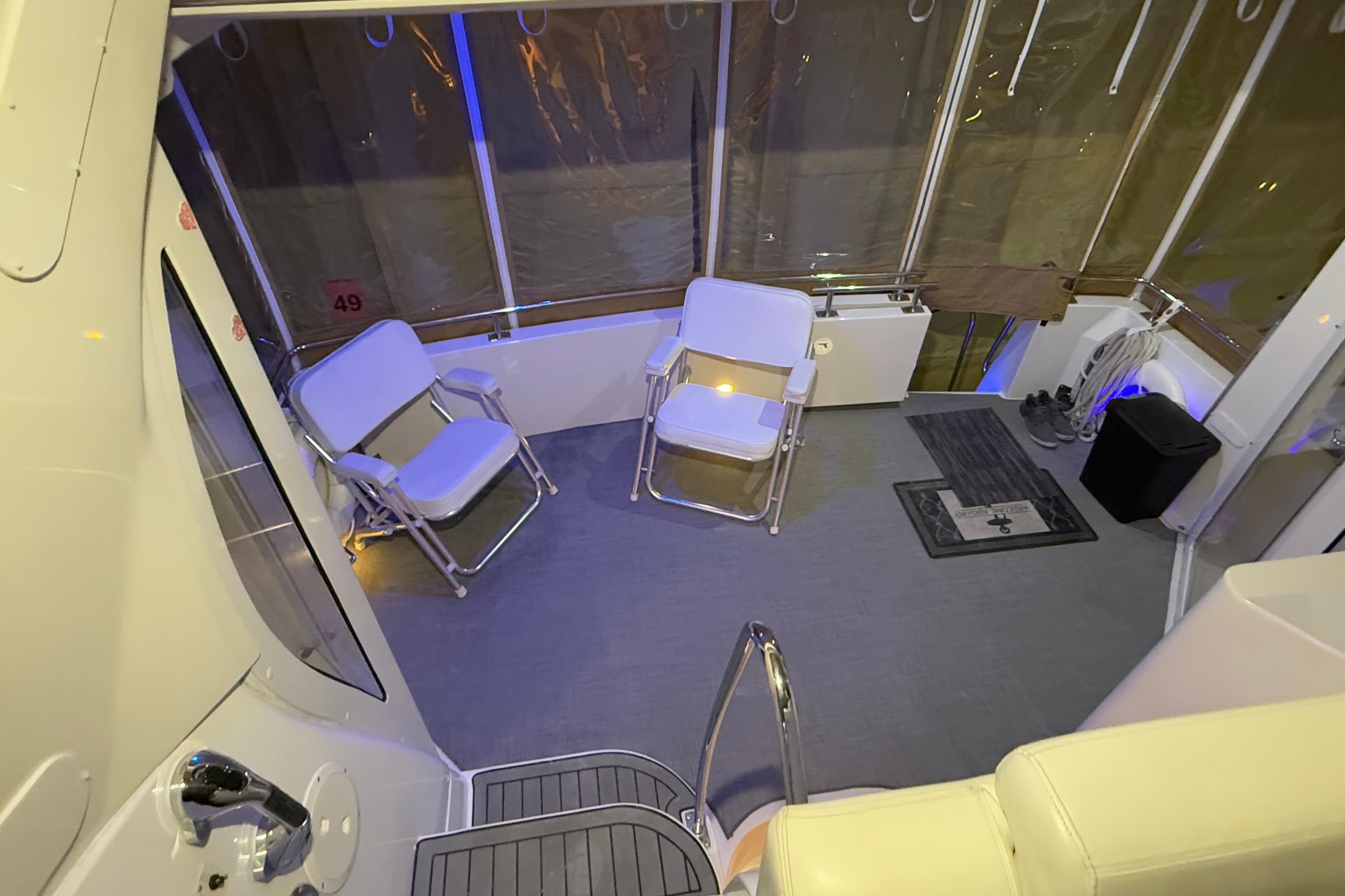Interior of 2000 Carver 396 Motor Yacht with seating and nautical decor.