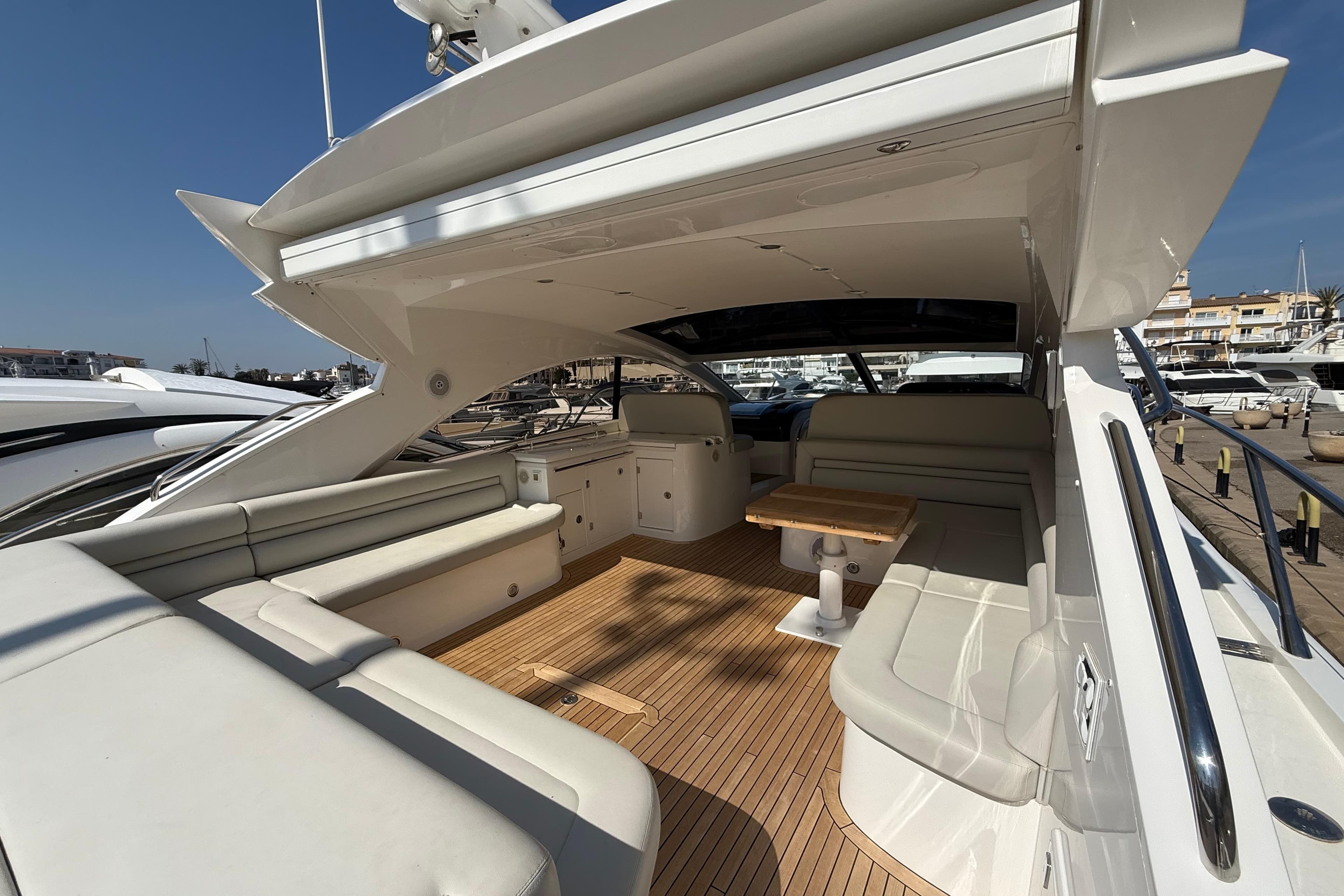 Luxurious 2012 Sunseeker Predator 60 yacht interior with spacious seating and elegant design.