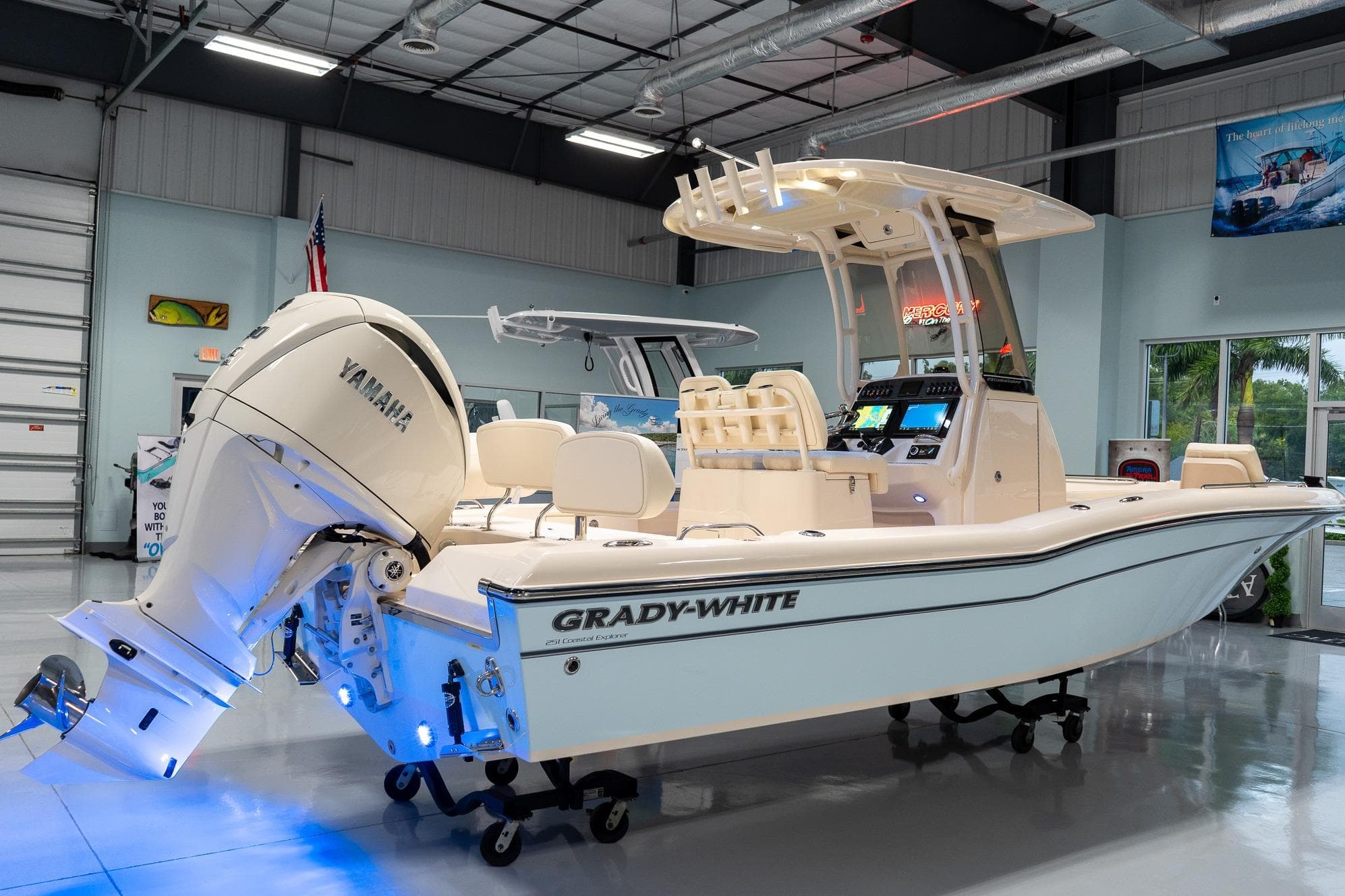 2025 Grady-White 251 Coastal Explorer boat in showroom with Yamaha engine.