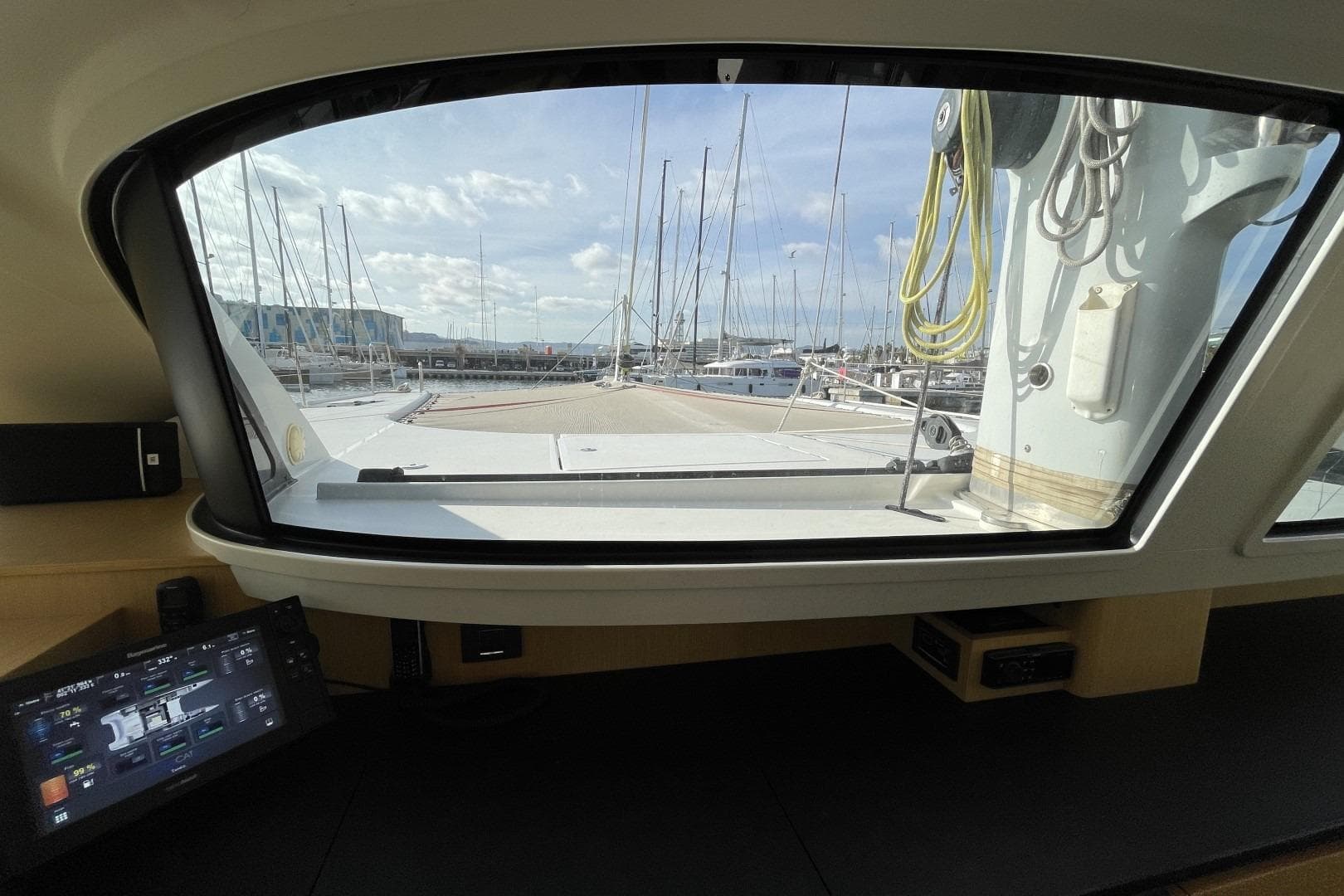 Interior view from 2017 Ice Yachts Ice Cat 61, showcasing marina and control panel.