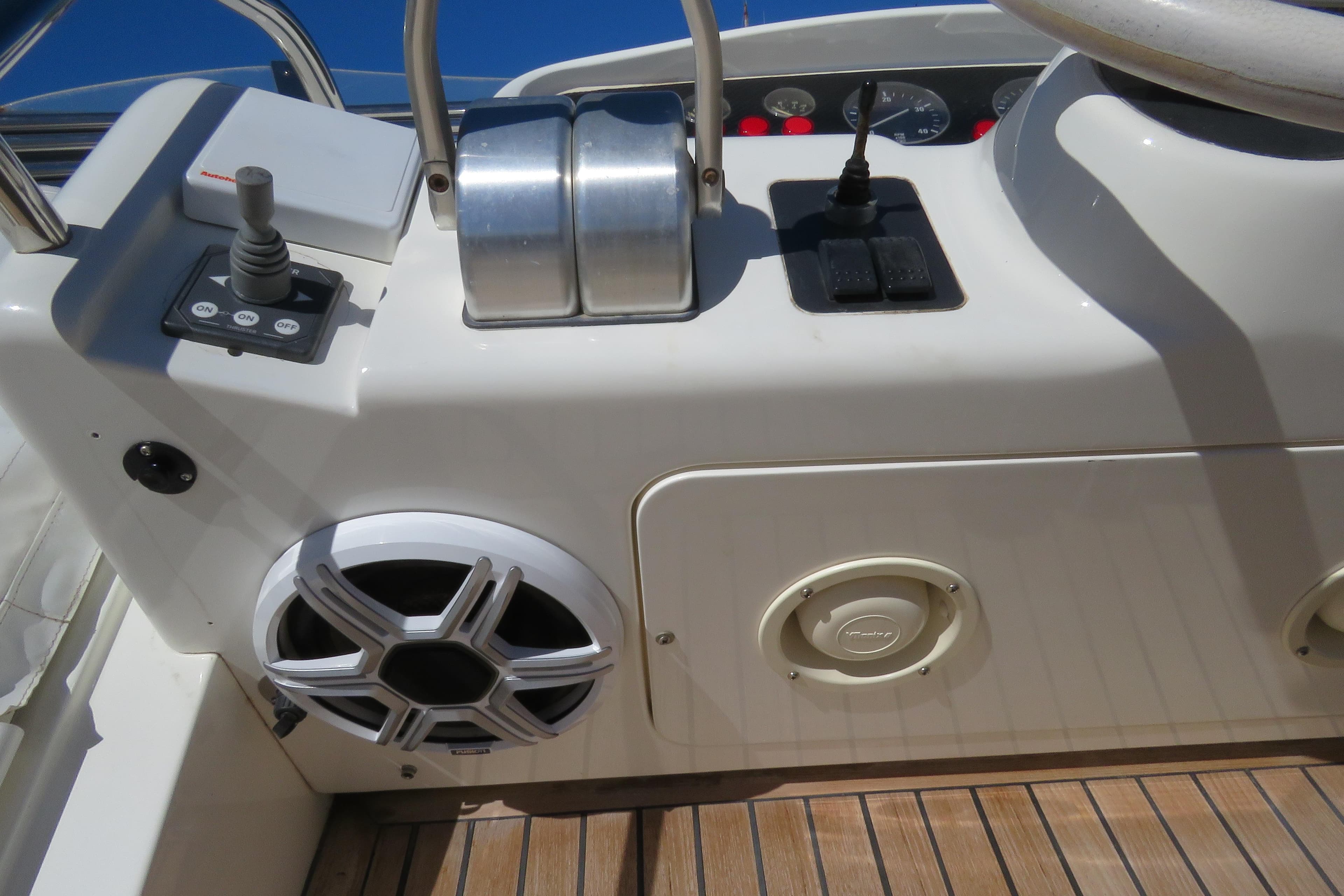 Control panel of a 1995 Princess 60 yacht with speaker and switches.