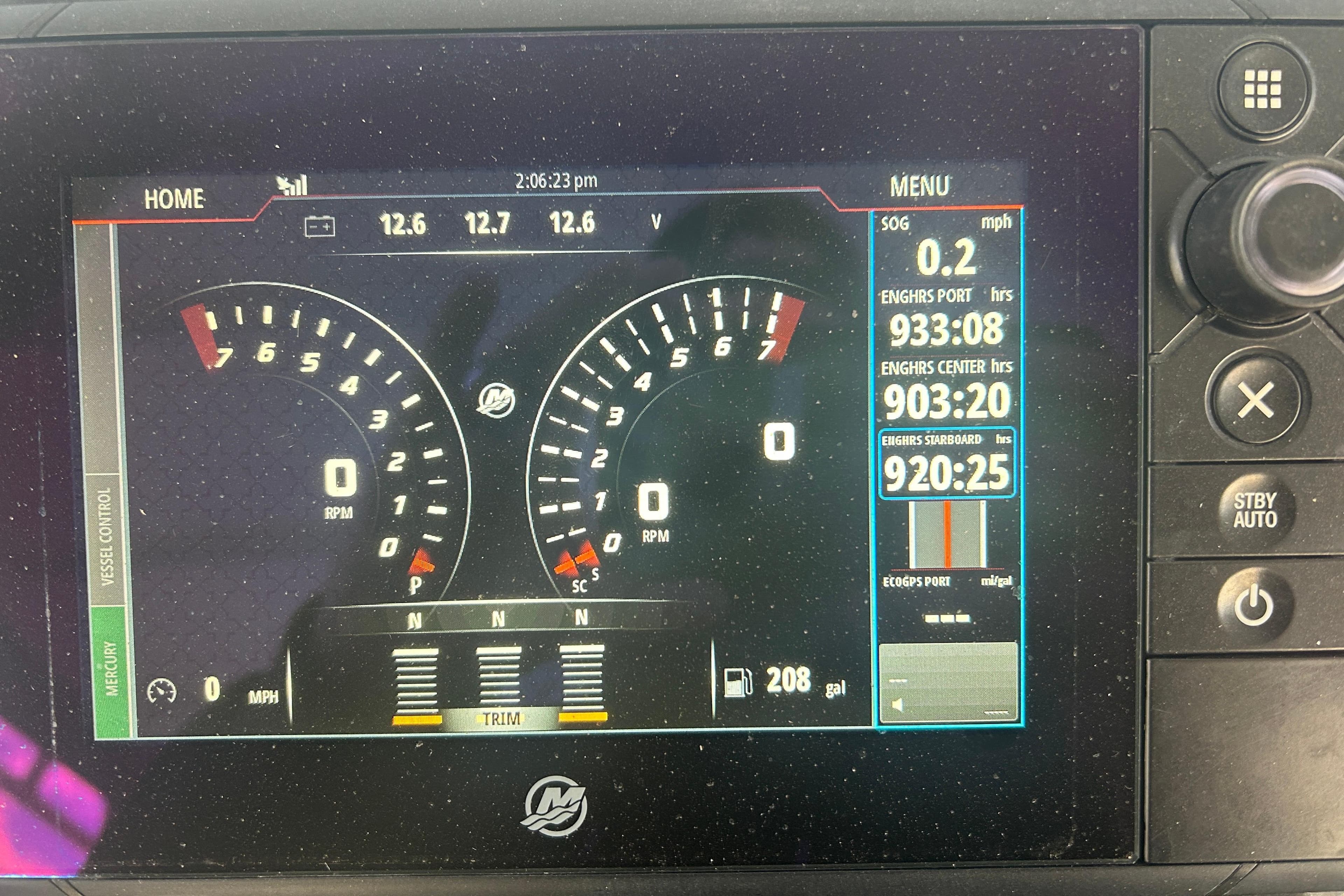 Dashboard of a 2007 Fountain 38 Sportfish Cruiser OB showing engine metrics and controls.