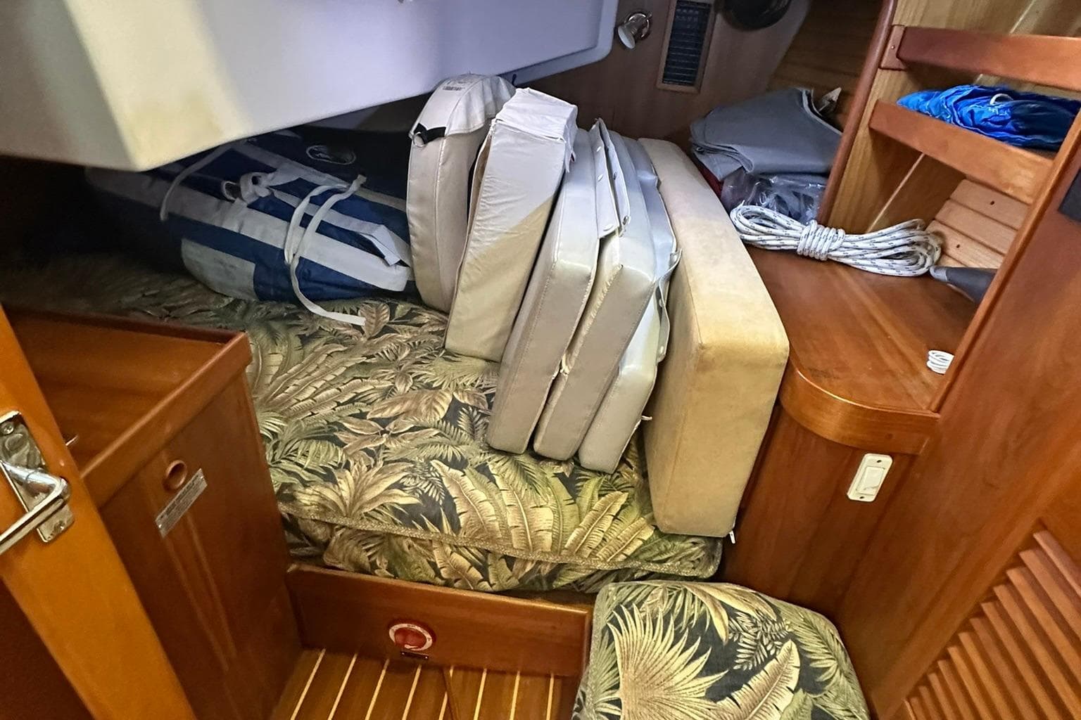 Interior of 2007 Sabre 386 sailboat with cushions and storage area.