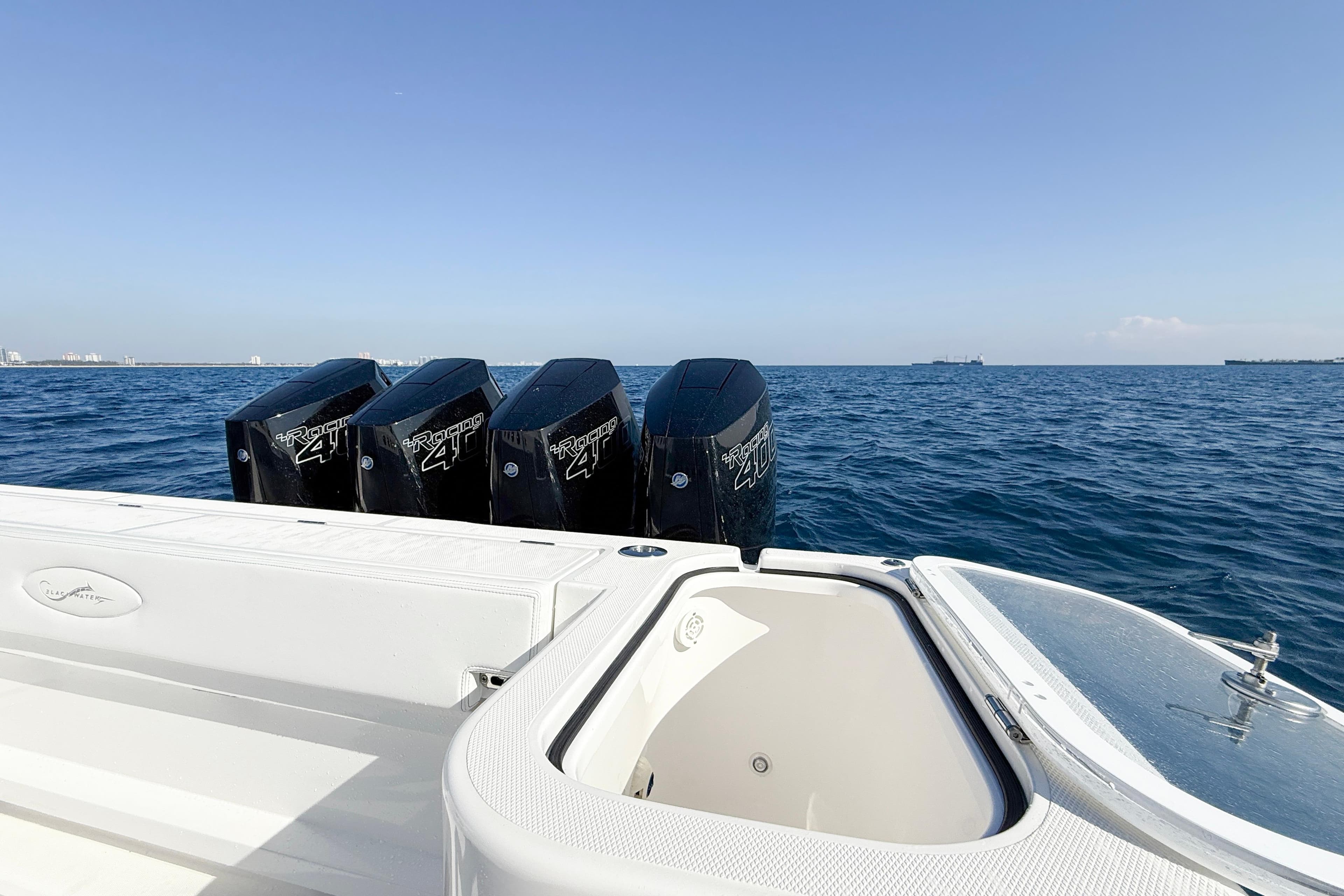 2026 Blackwater 41 Sportfish boat with four powerful outboard engines on open sea.