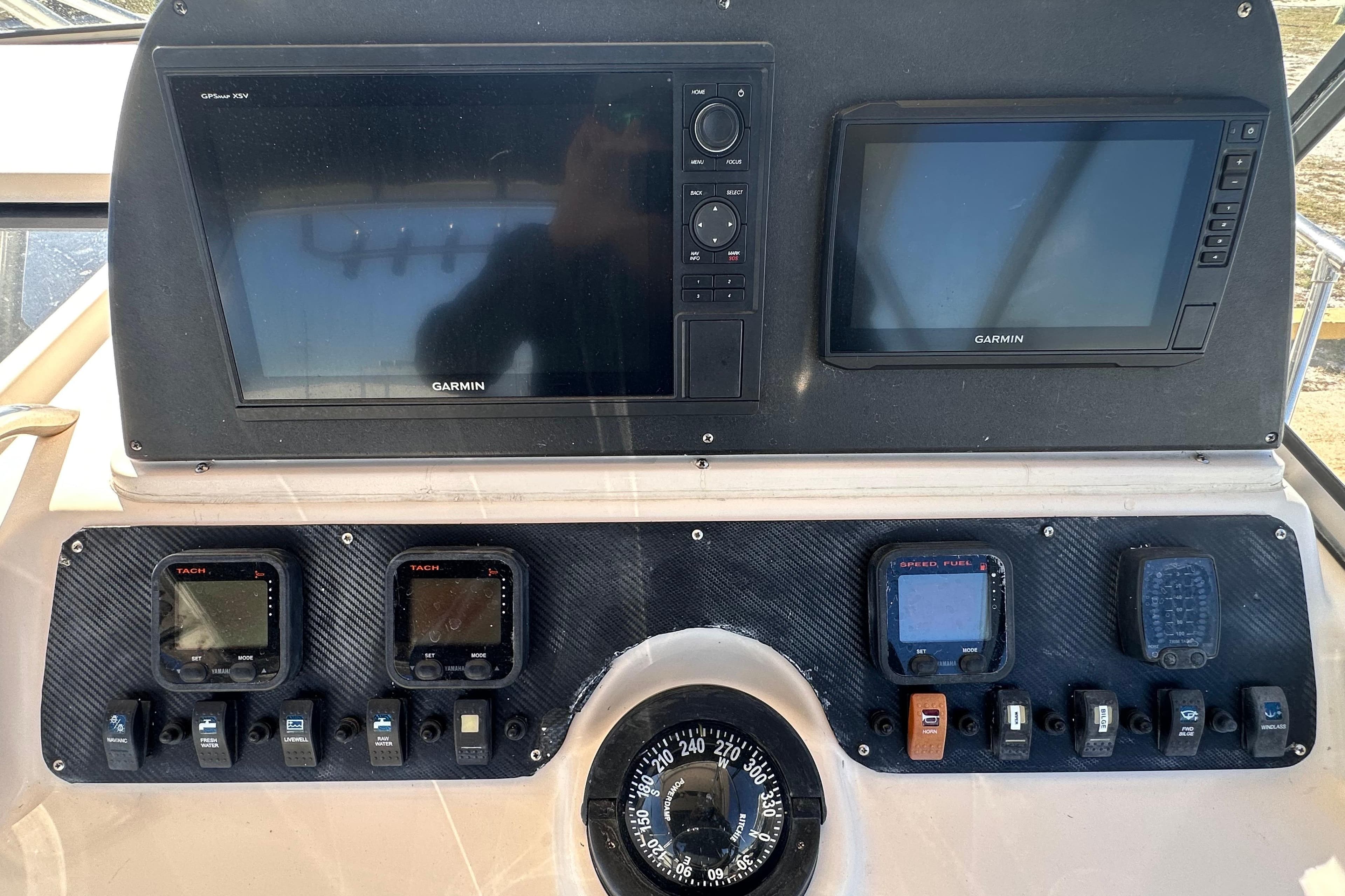 Dashboard of a 2007 Grady-White Marlin 300 with Garmin navigation displays.