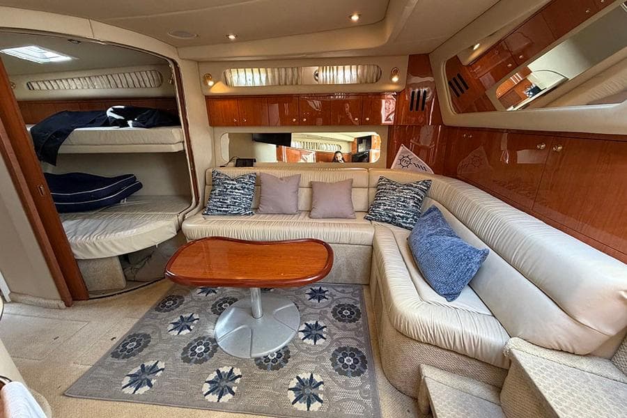 Luxurious interior of a 2001 Sea Ray 410 Express Cruiser with plush seating and elegant decor.