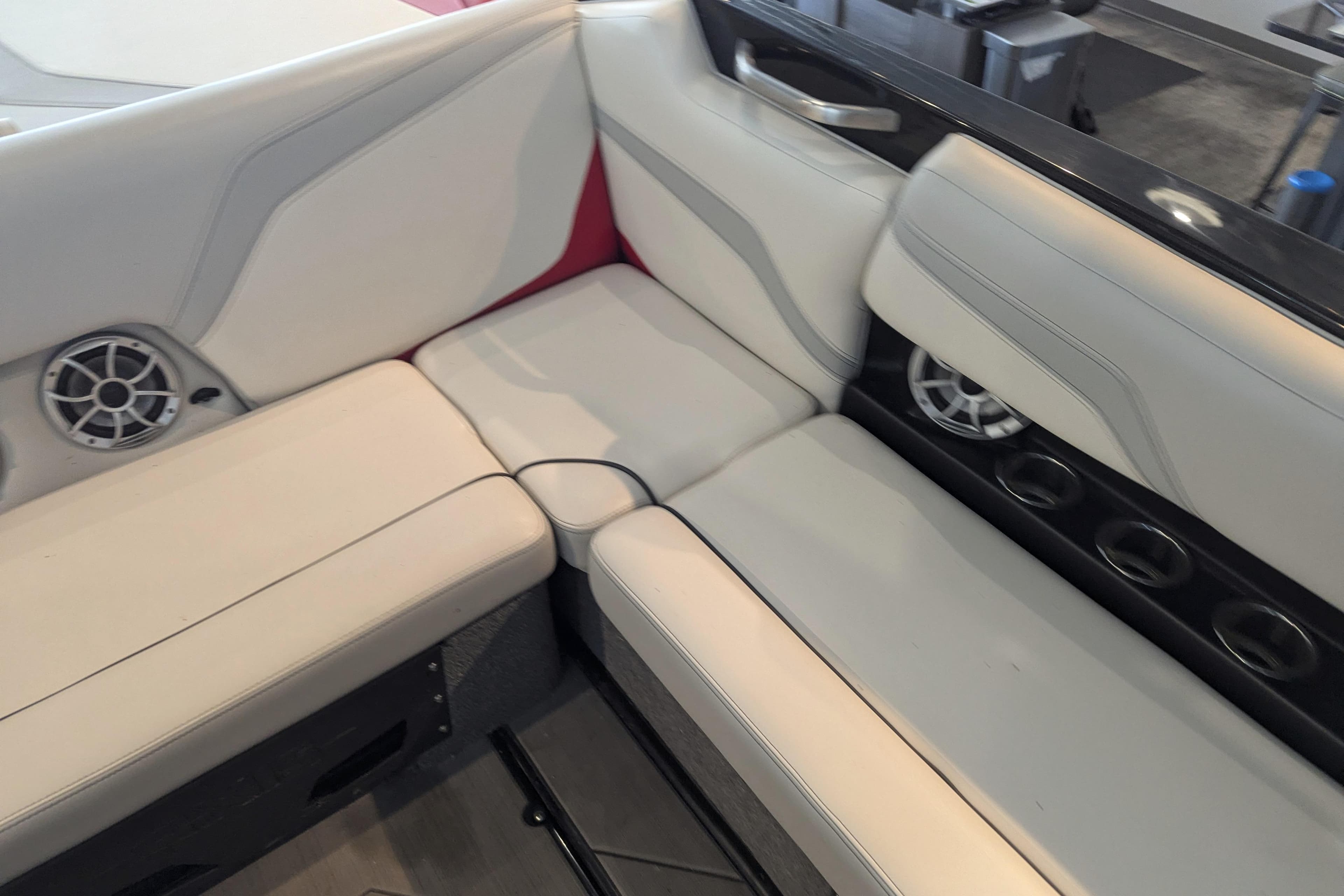 2018 Axis T23 boat interior with white seating and built-in speakers.