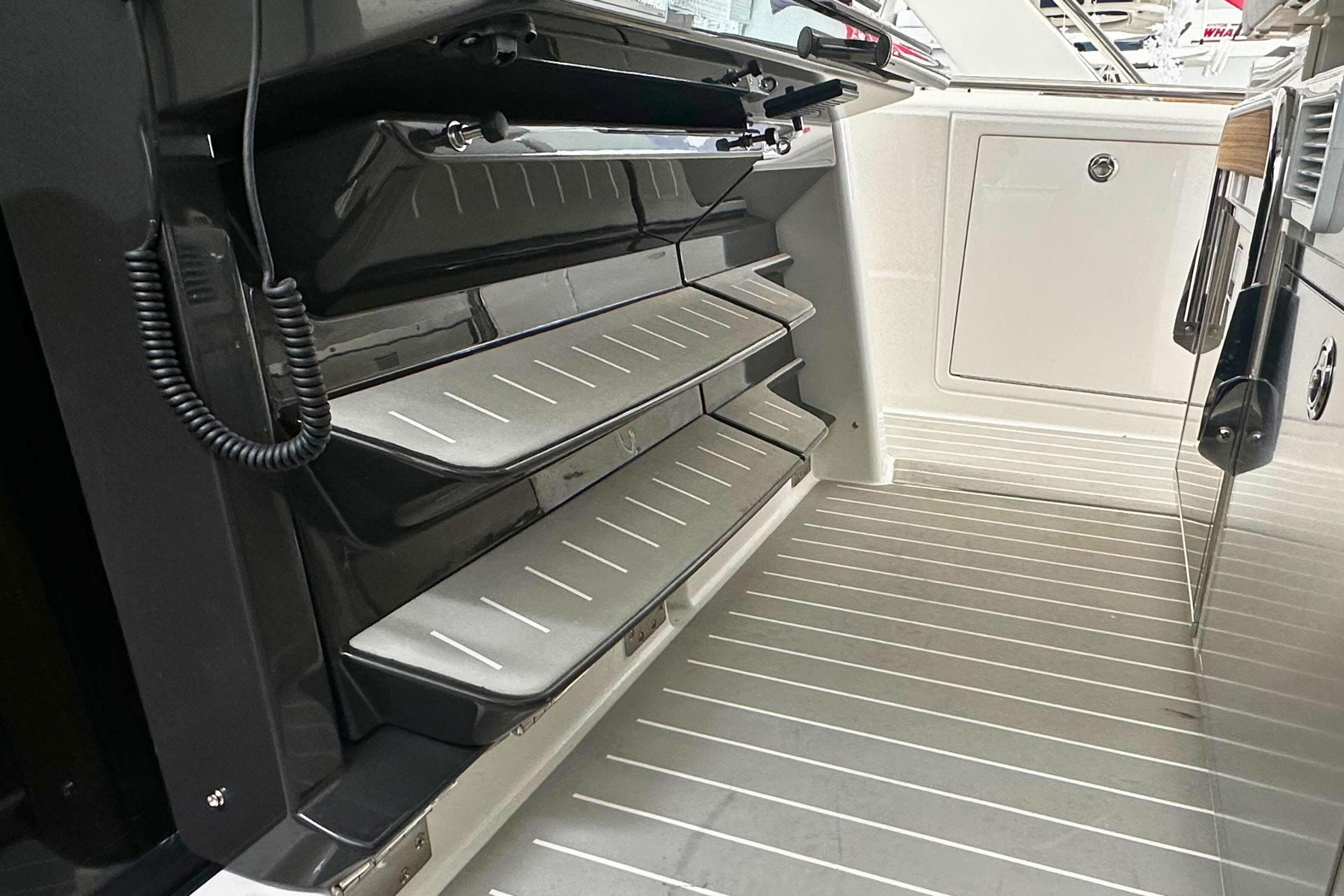 2026 Tiara Yachts 39 LS interior with sleek, modern design and foldable steps.