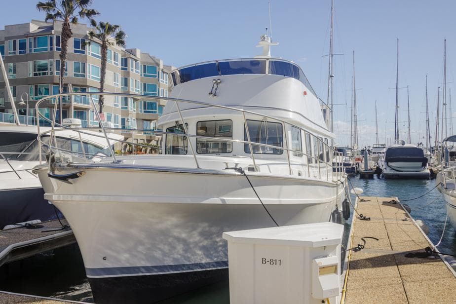 2025 Bracewell 41 yacht docked at a marina with modern buildings in the background.