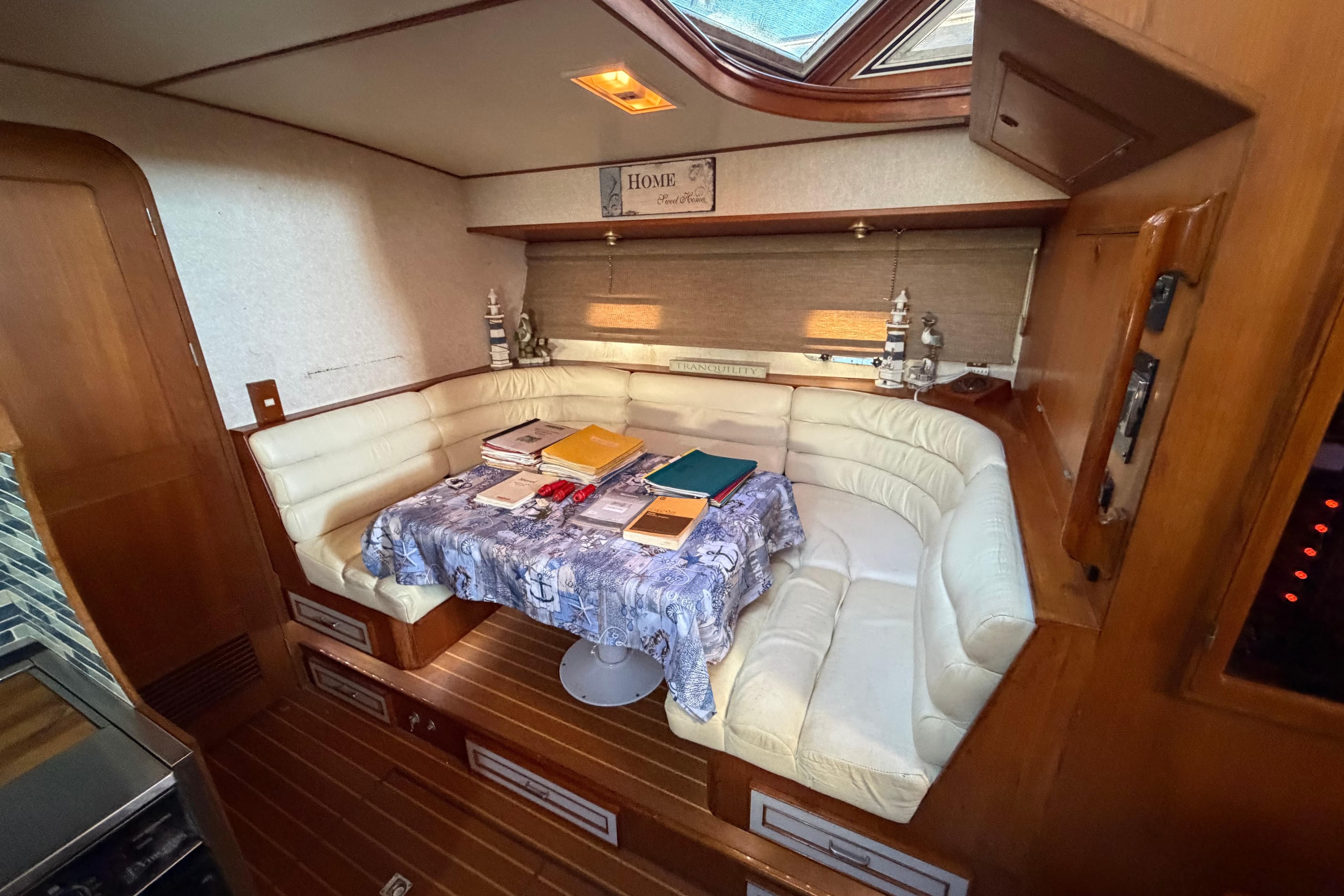 Interior of 1987 Hi-Star 55 Yacht Fisherman with cozy seating and nautical decor.