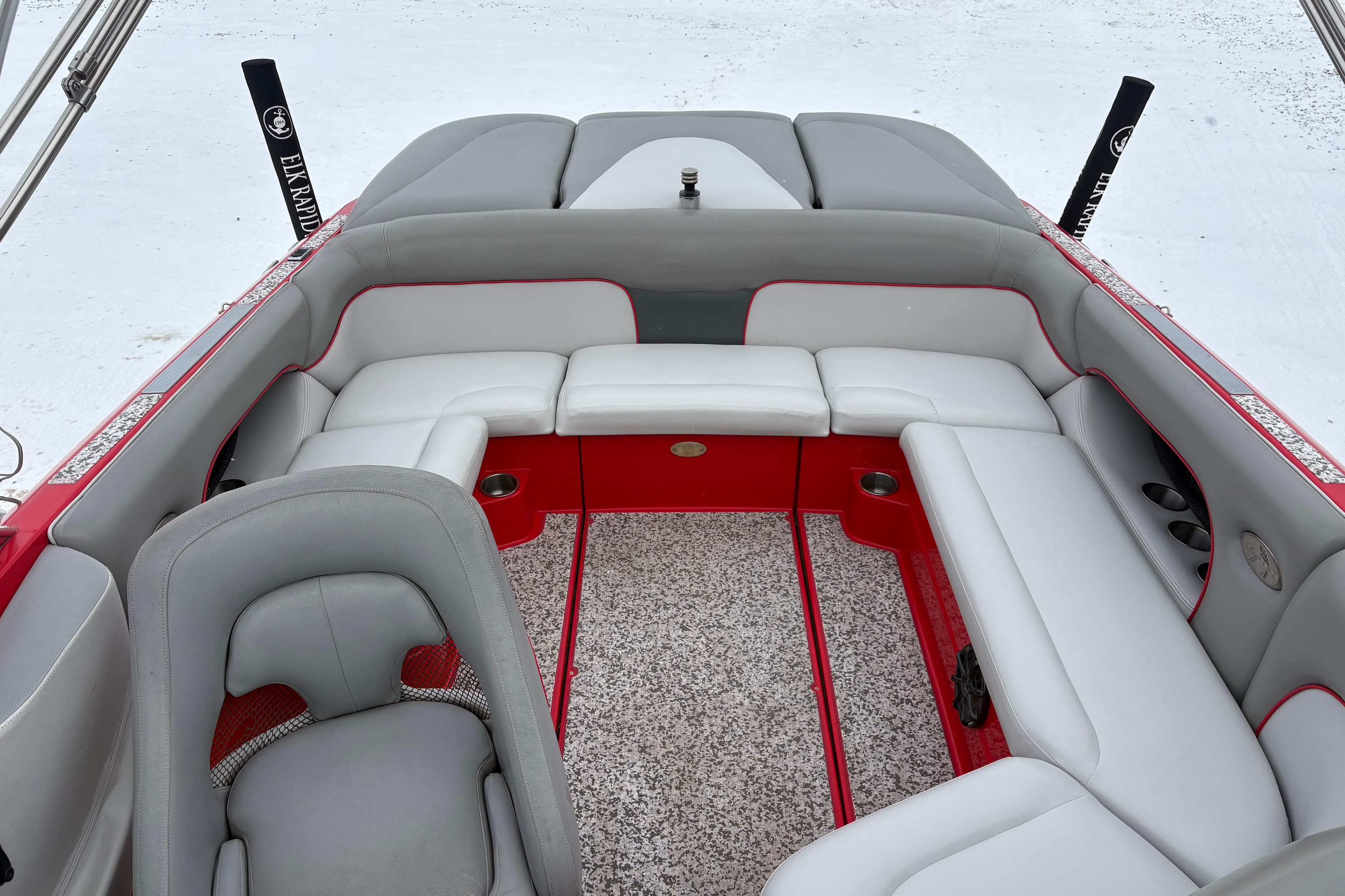2006 Centurion Enzo SV230 boat interior with gray and red seating, spacious layout.