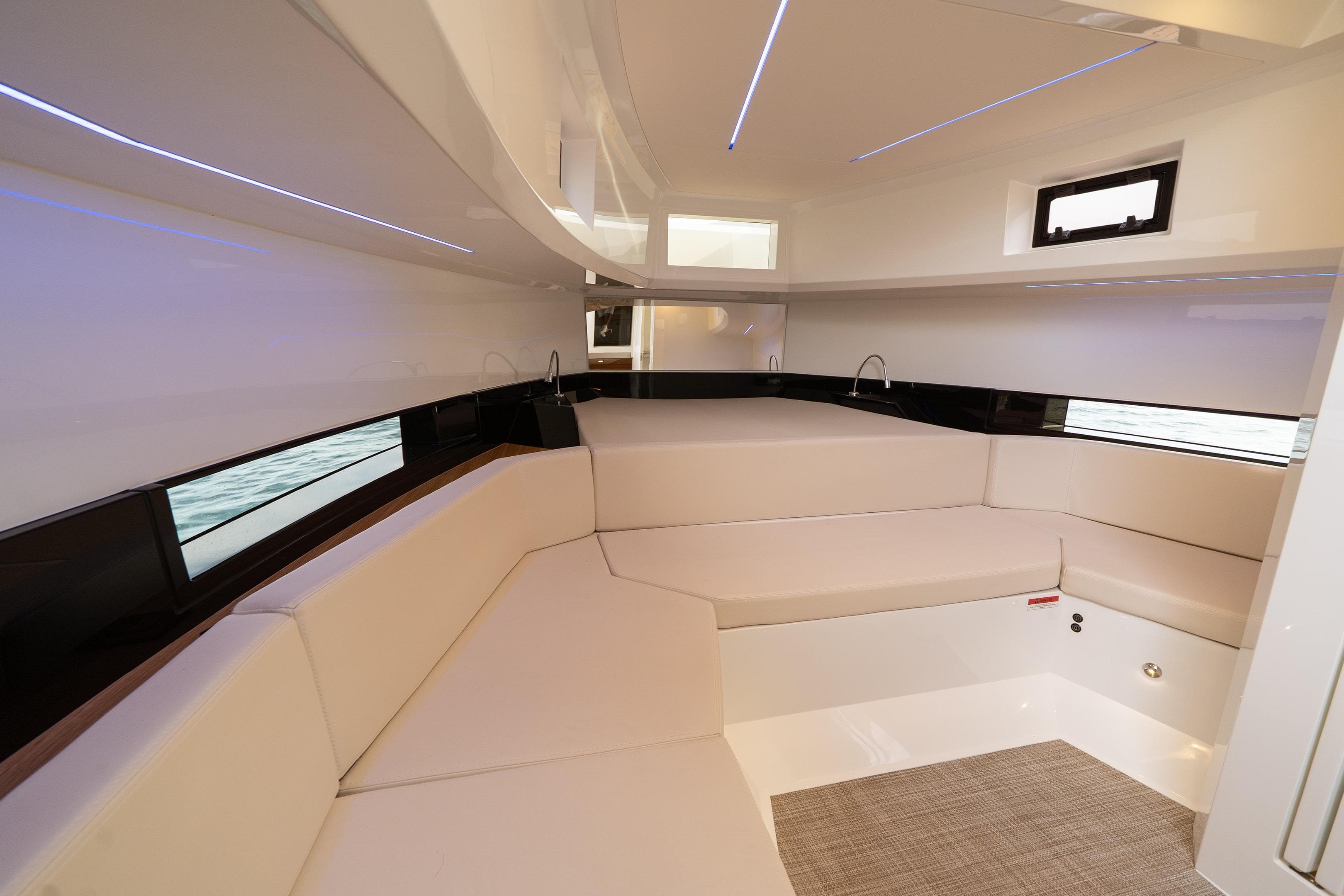 Luxurious interior of 2025 De Antonio Yachts D36 with modern seating and sleek design.