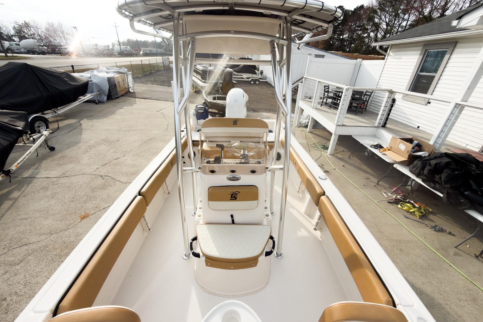2025 Carolina Skiff 21 Ultra Elite boat interior with tan seating and console.