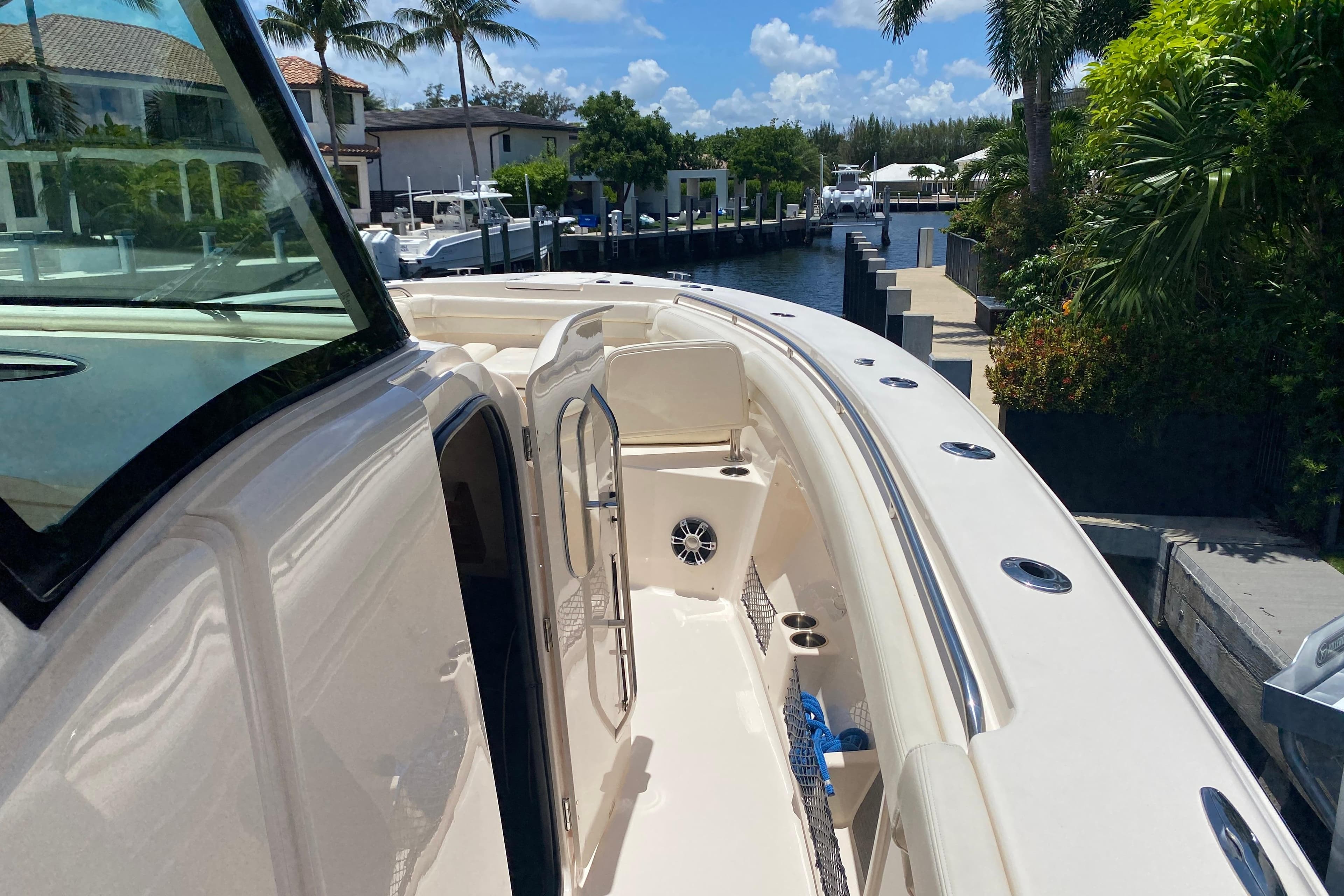 2021 Grady-White Canyon 376 boat docked, showcasing sleek design and spacious deck.