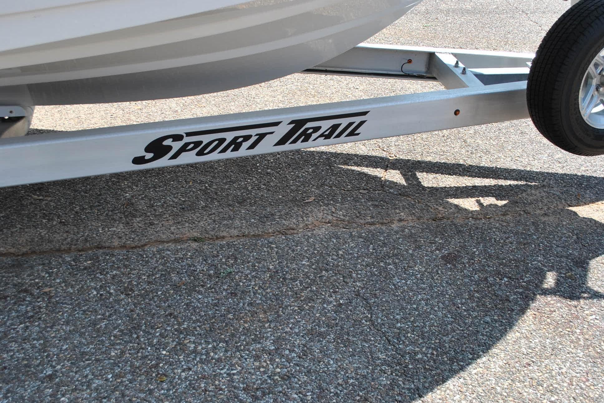 Trailer for 2020 Sportsman Open 232 Center Console boat on pavement.
