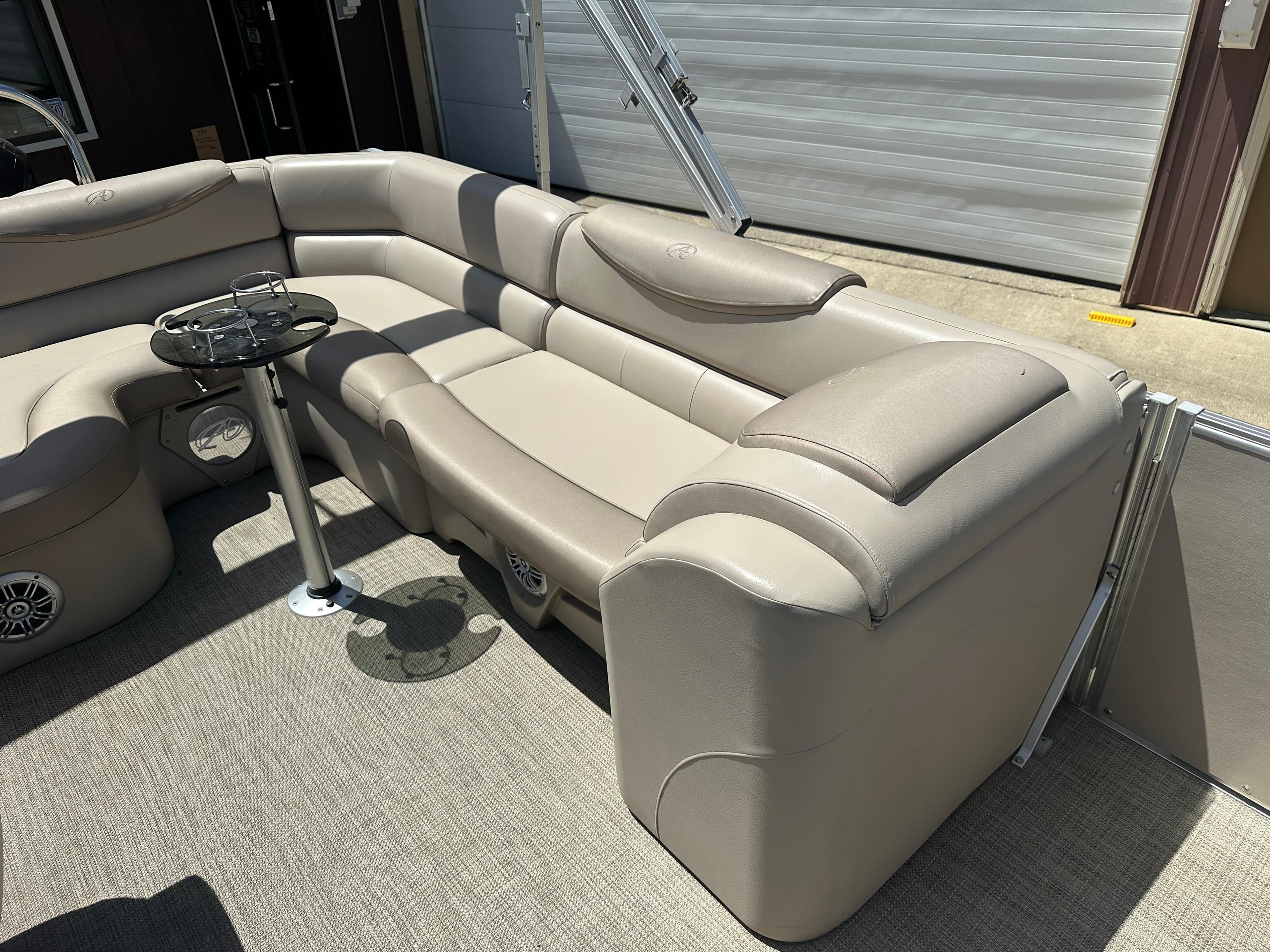 Luxurious seating on 2018 Avalon Catalina Cruise 25' pontoon boat with beige upholstery.