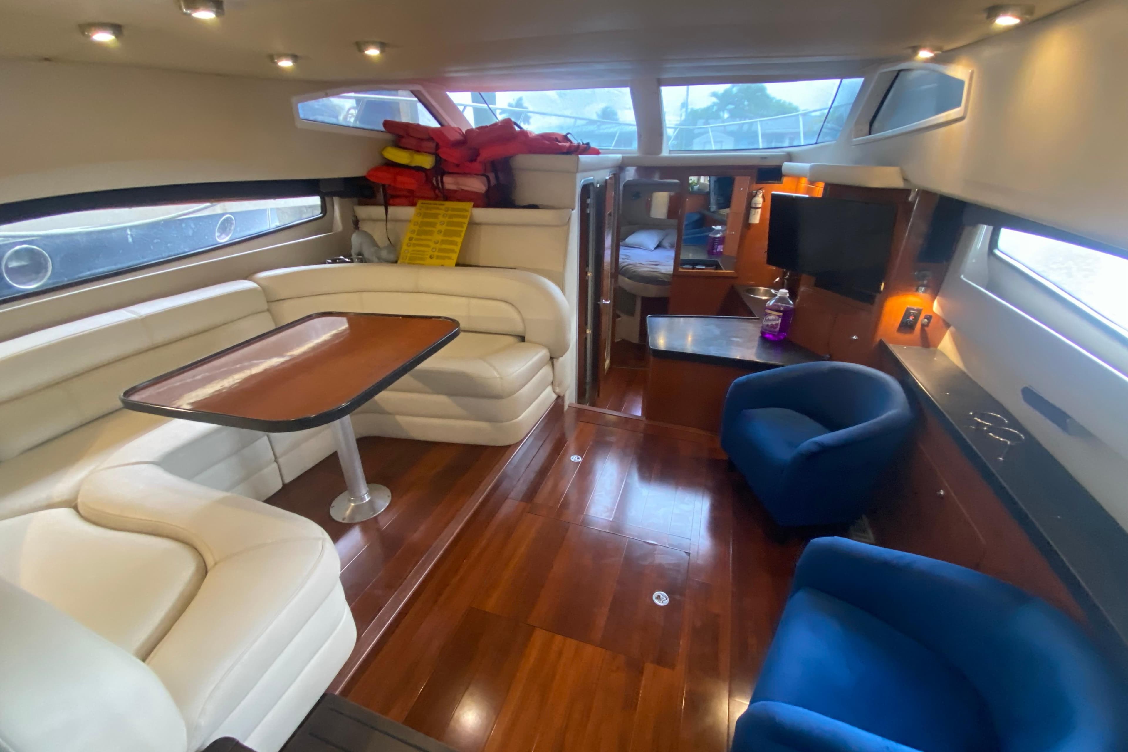 Luxurious interior of 2006 Regal Commodore 3880 yacht with plush seating and modern amenities.