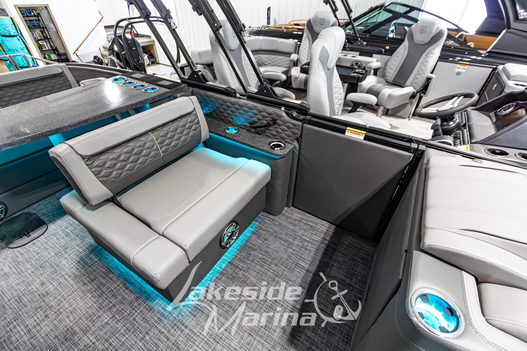 Luxurious interior of 2026 Godfrey Sanpan 2700 MTF pontoon boat with plush seating.