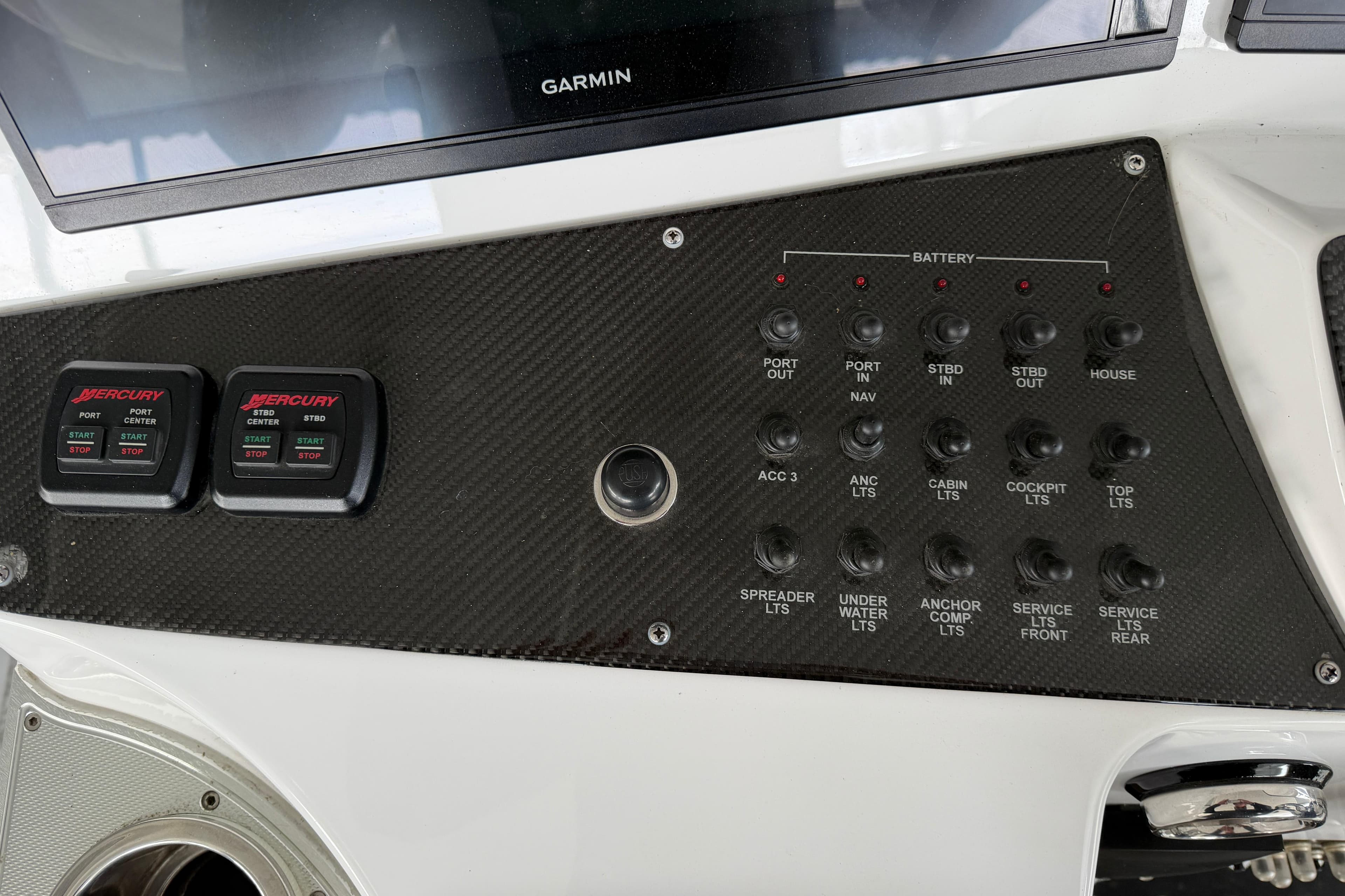 Control panel of a 2017 Cigarette 41' GTR boat with Mercury start-stop switches.