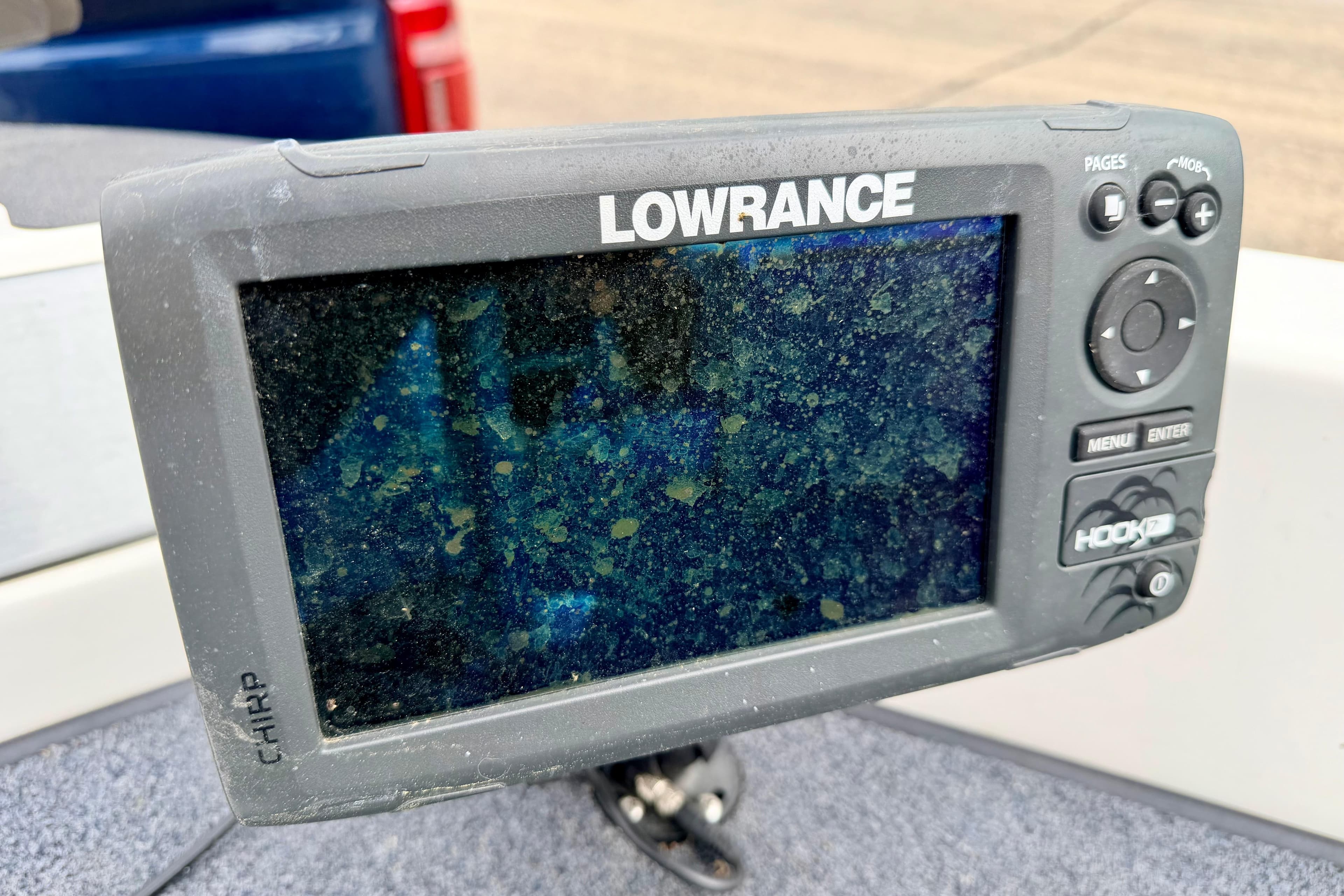 Lowrance fish finder on a 2012 Skeeter SL 185 boat, displaying a sonar screen.