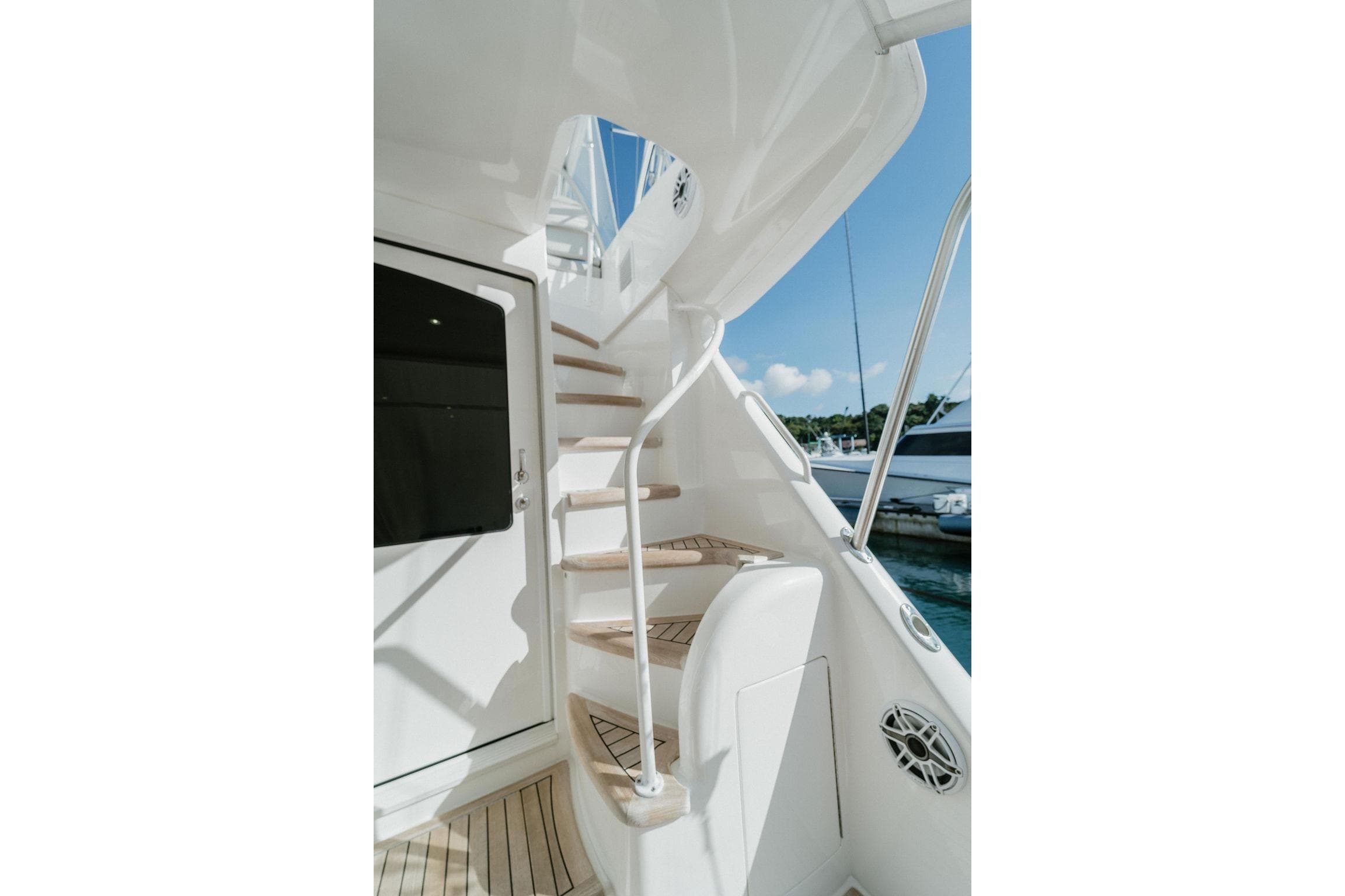 Staircase on 2021 Viking 58 Convertible yacht, featuring sleek design and ocean view.