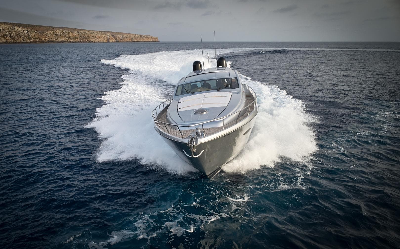 Luxury Pershing 72 yacht cruising on open sea, 2007 model.