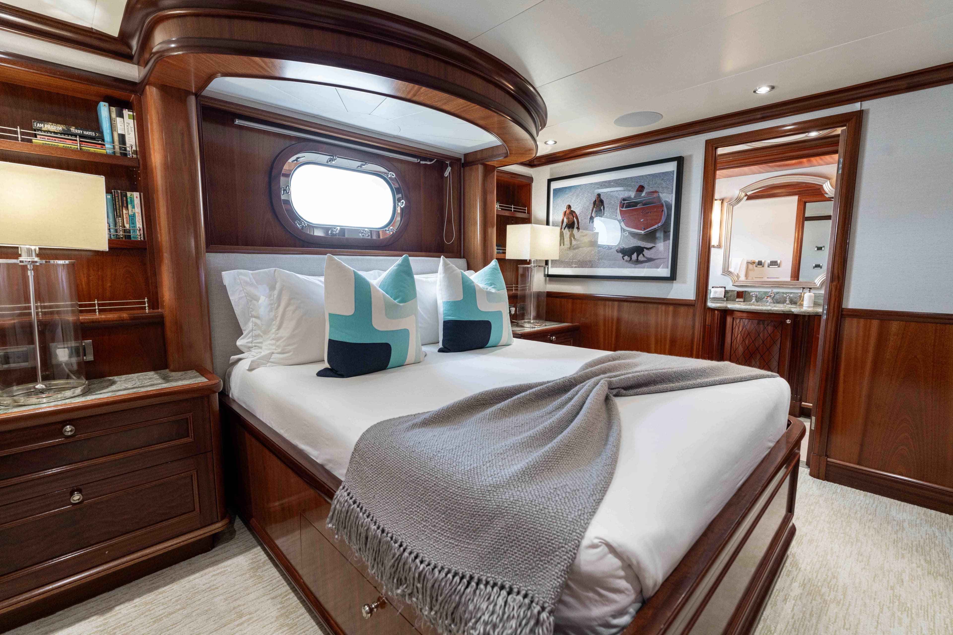 Luxurious bedroom on a 2008 Richmond Yacht with wooden furnishings.