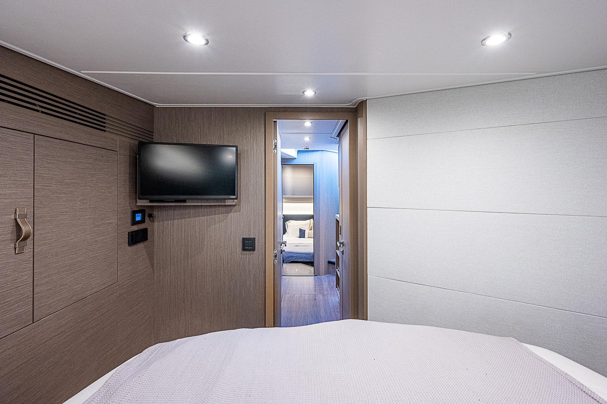 Interior cabin of 2022 Beneteau Gran Turismo 45 yacht with TV and modern decor.