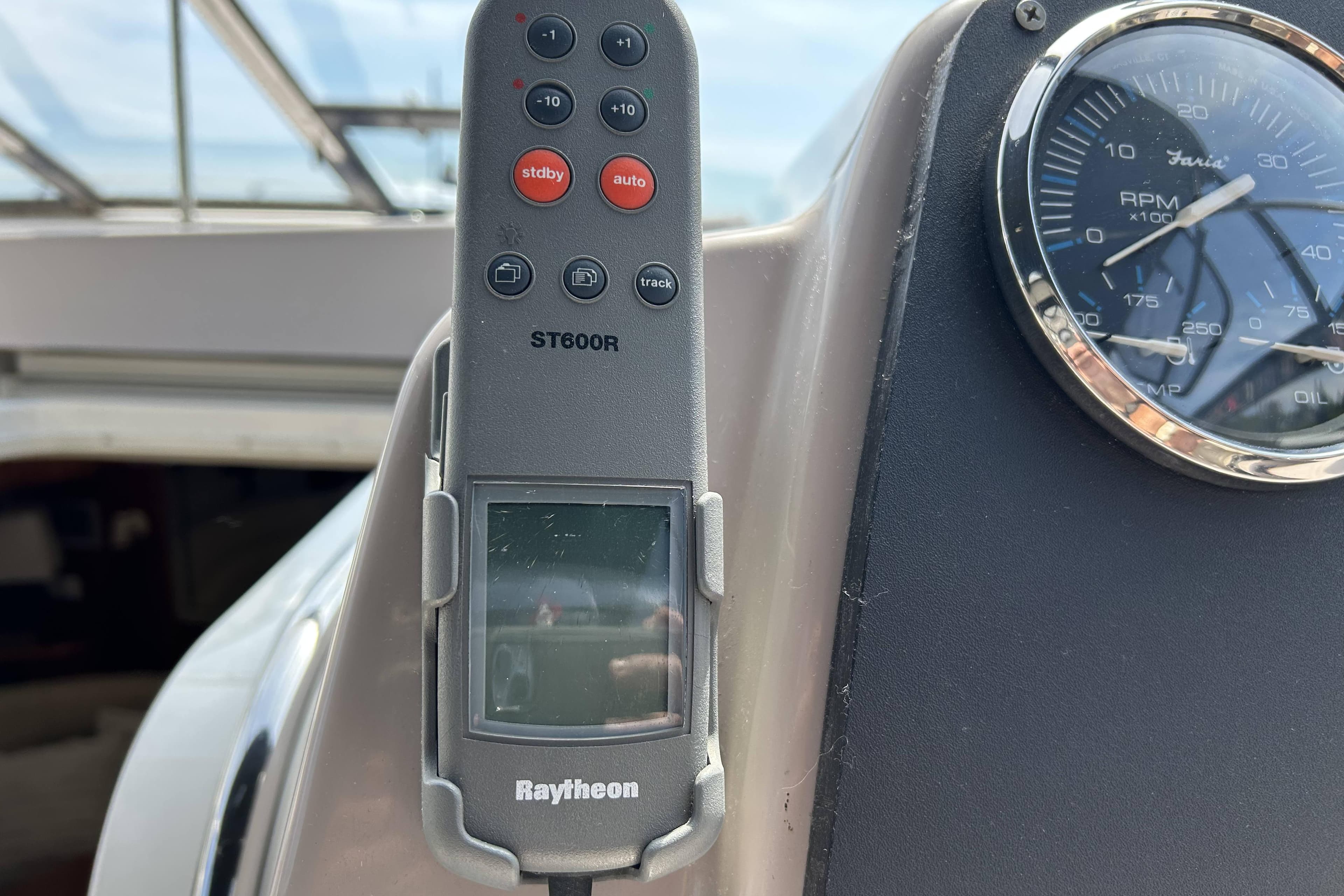 Raytheon ST600R control panel and Faria RPM gauge on 2002 Regal Commodore 4260 boat.