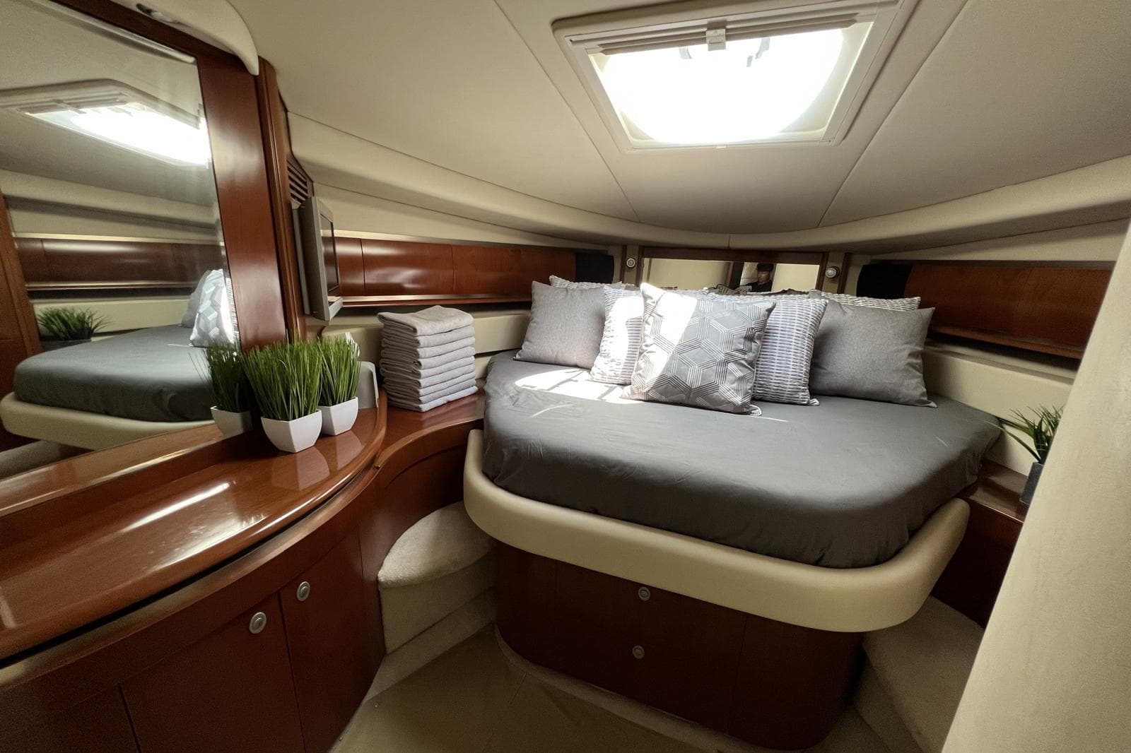 Luxurious cabin interior of 2005 Sea Ray 500 Sundancer yacht with elegant bedding.