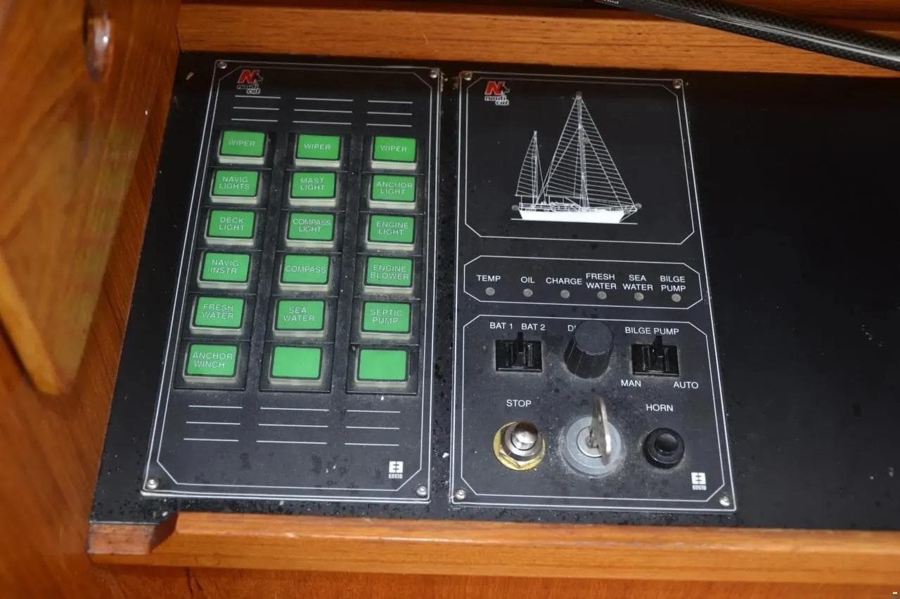 Control panel of a 1991 Nauticat 32 sailboat with various switches and indicators.