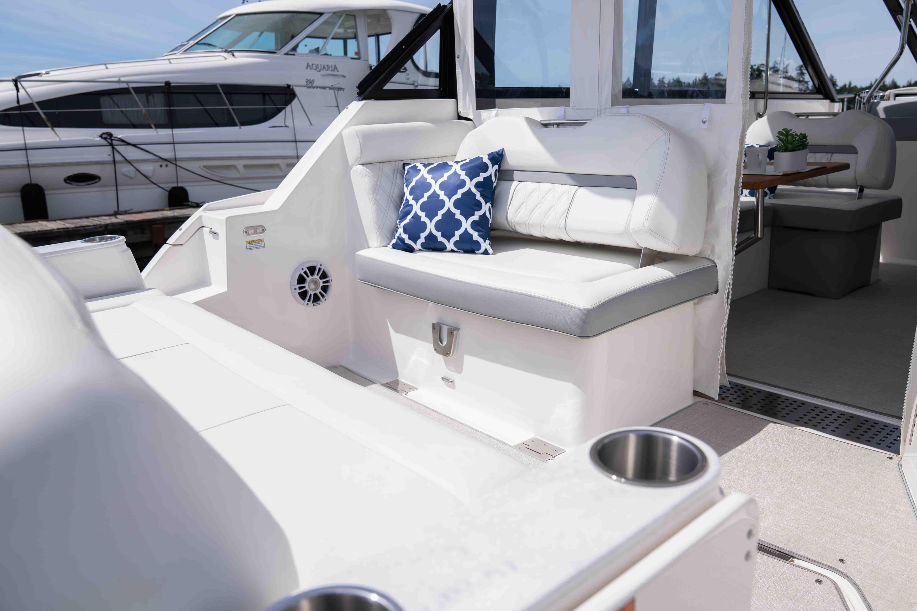 2024 Regal 36 Grande Coupe interior with white seating and blue cushion.