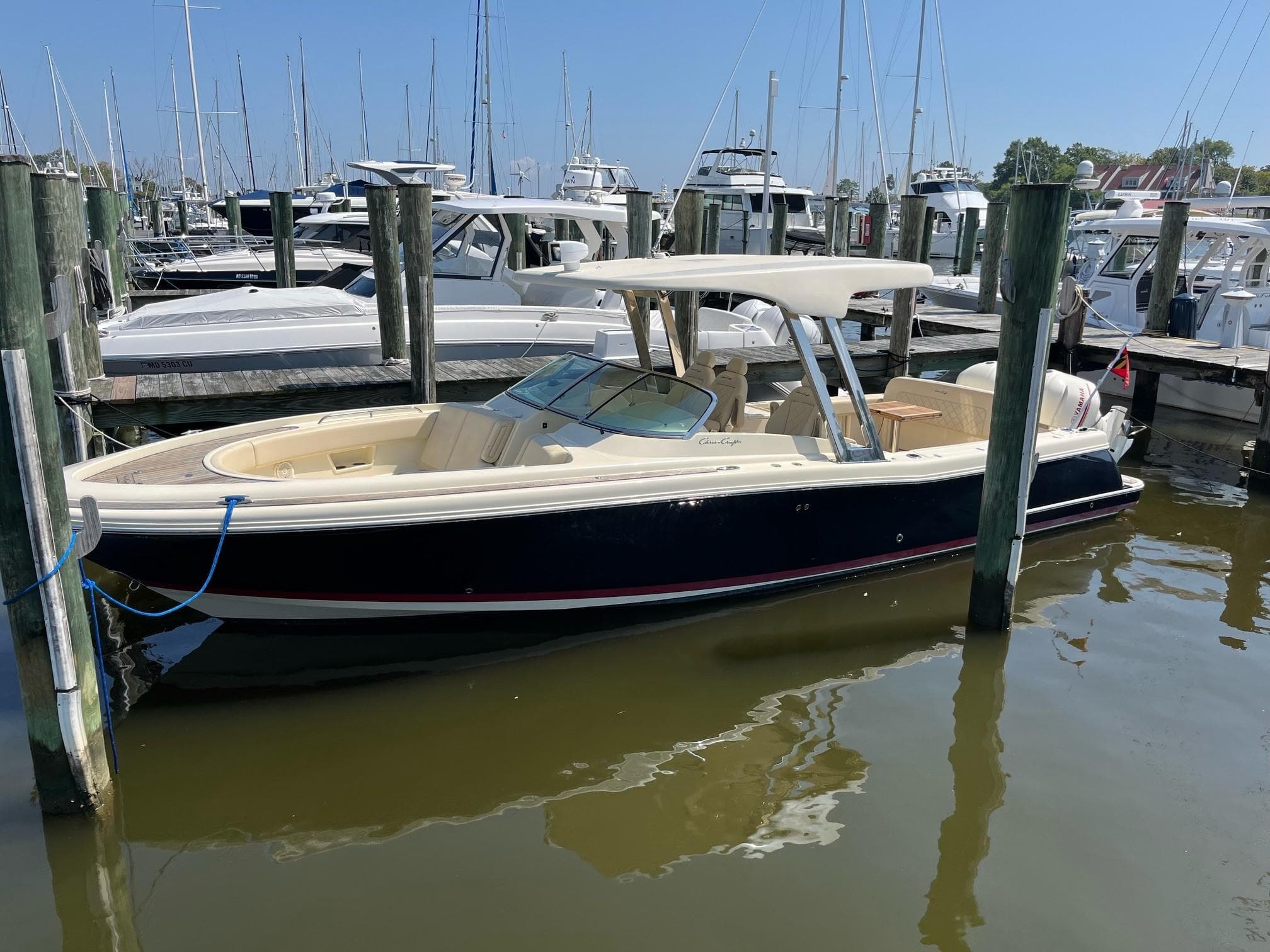 2019 Chris-Craft Calypso 30 docked in a marina.