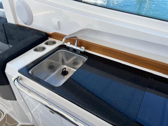 Modern boat kitchenette with sink and faucet, Nimbus W9 2023 model.