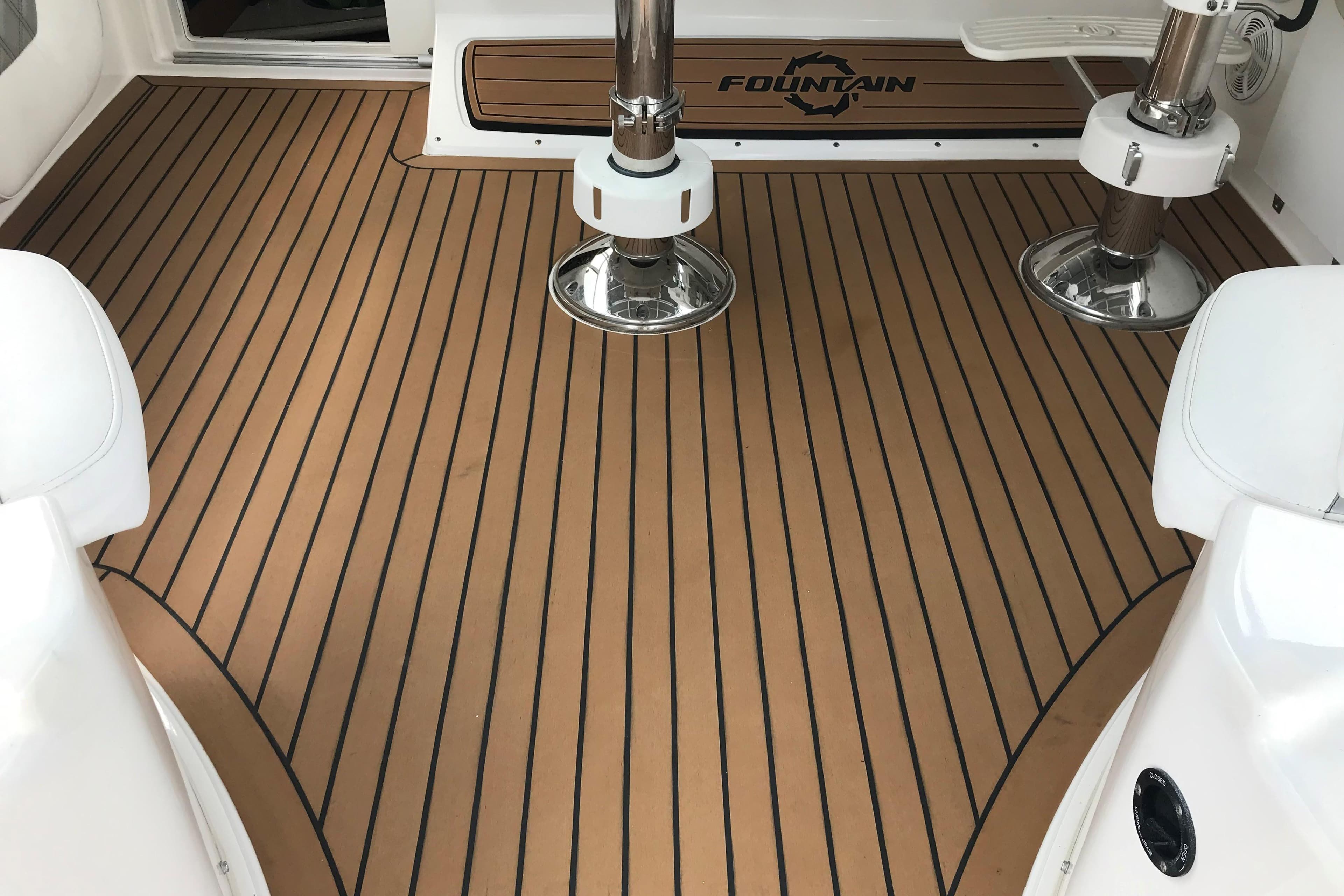 2007 Fountain 38 Sportfish Cruiser OB deck with teak flooring and seating.