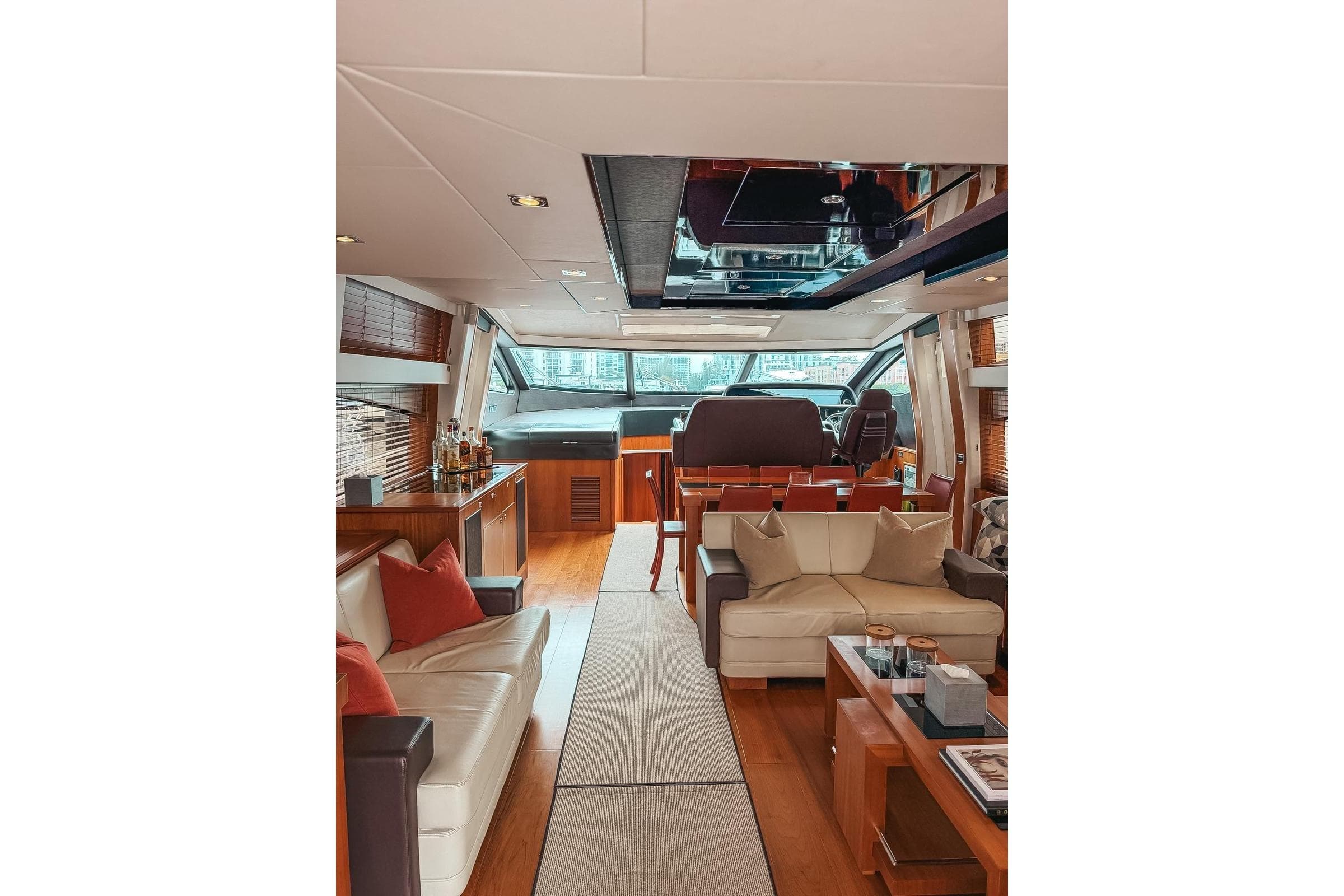 Luxurious interior of a 2010 Sunseeker Predator 84 yacht with elegant seating and modern design.