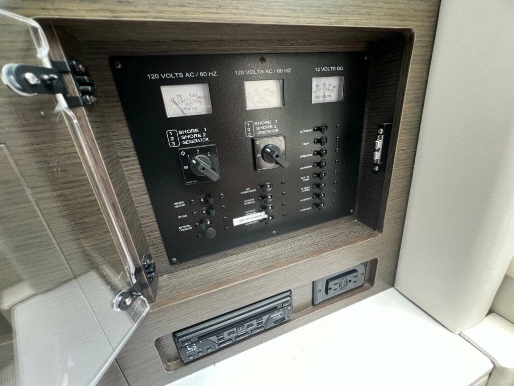 Electrical control panel on a 2020 Cobalt A36BR boat, featuring switches and meters.