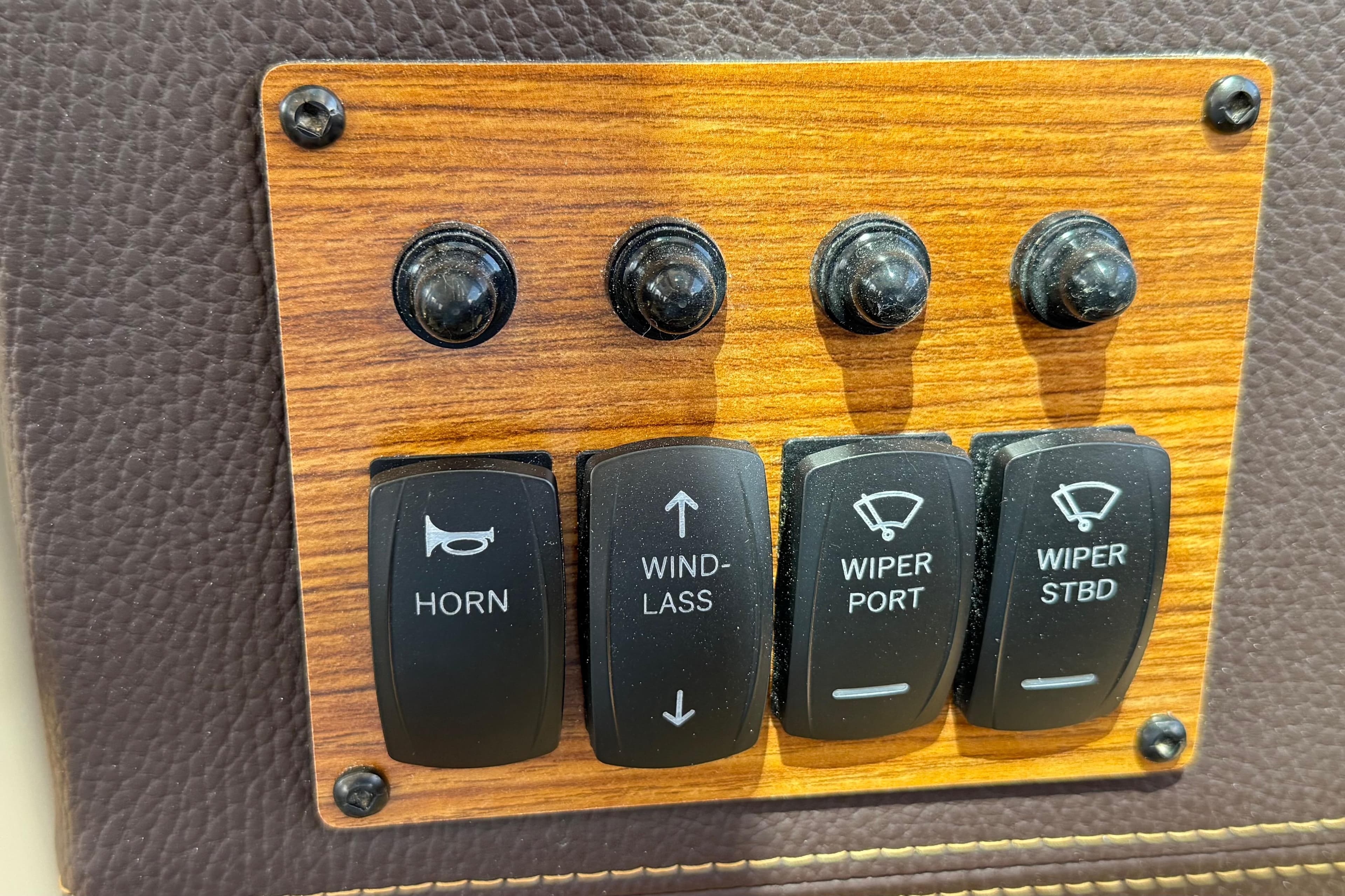 Control panel of 2025 Ranger Tugs R-23 boat with horn and wiper switches.