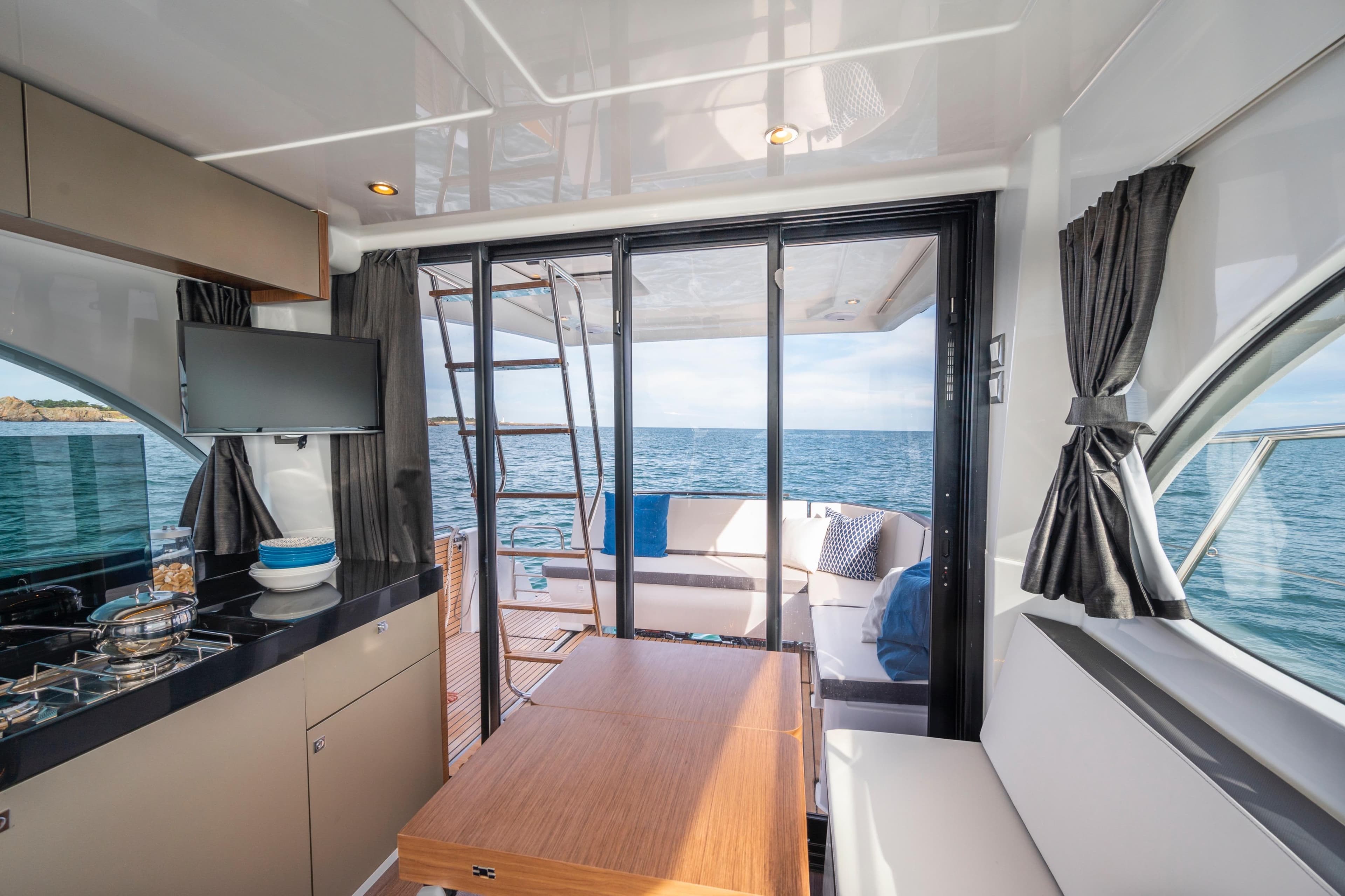 Interior of 2026 Beneteau Antares 11 Coupe with ocean view.