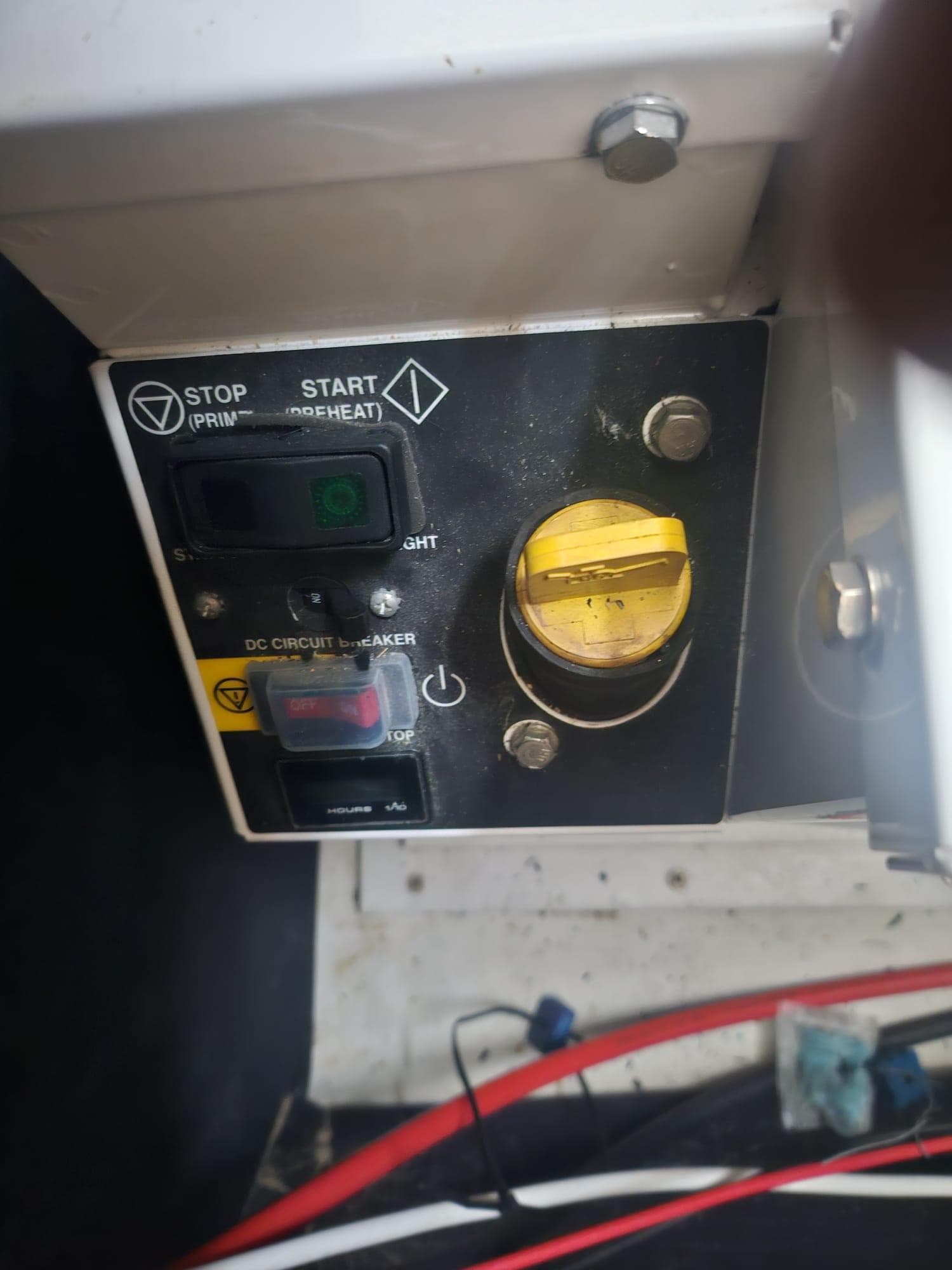 Control panel of a 2011 Fountaine Pajot Lipari 41 catamaran with start and stop buttons.