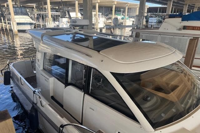 2022 Nimbus 365 Coupe docked in a marina, showcasing sleek design and modern features.