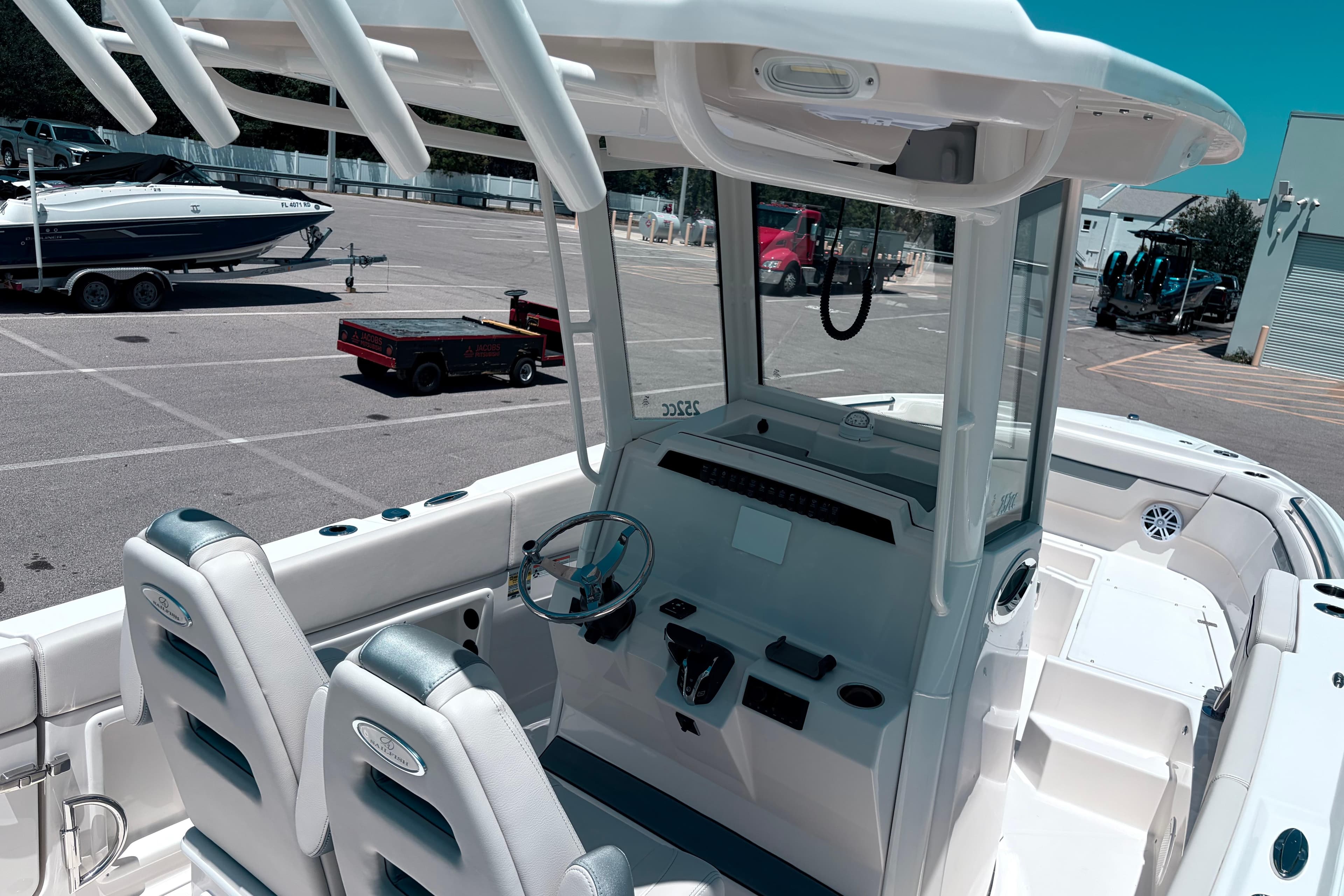 2026 Sailfish 252 CC boat interior with dual seats and steering console.
