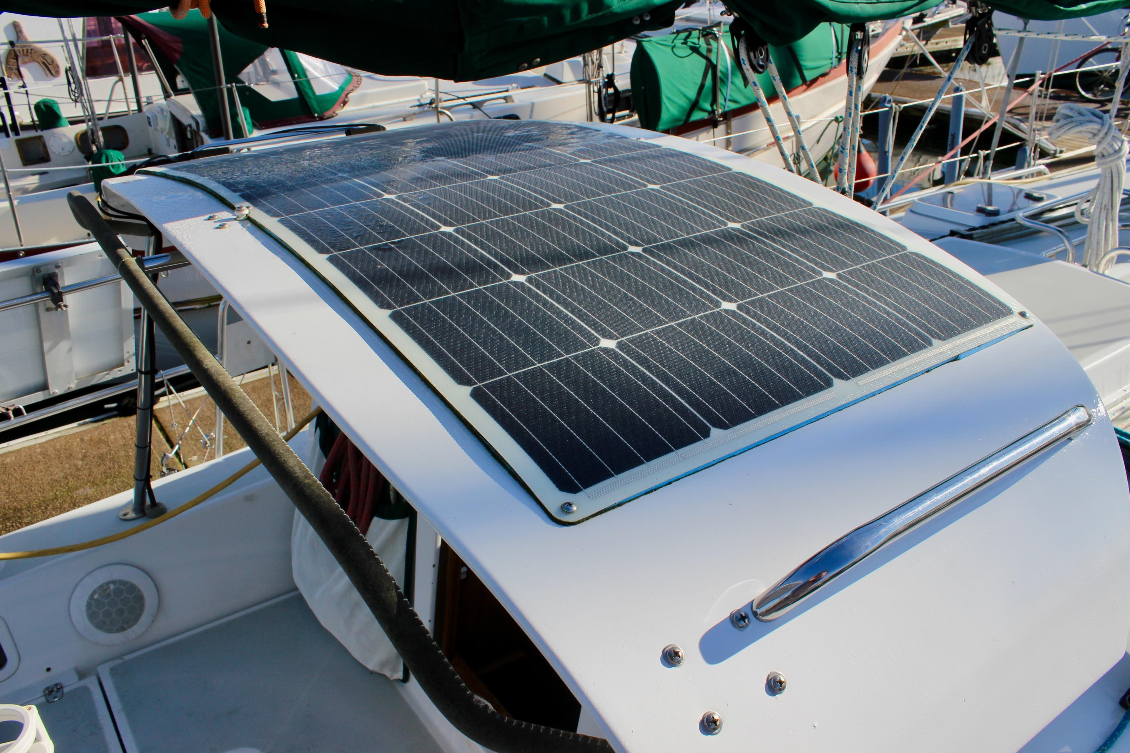 Solar panel on 1997 Valiant 39 yacht, docked with other boats.